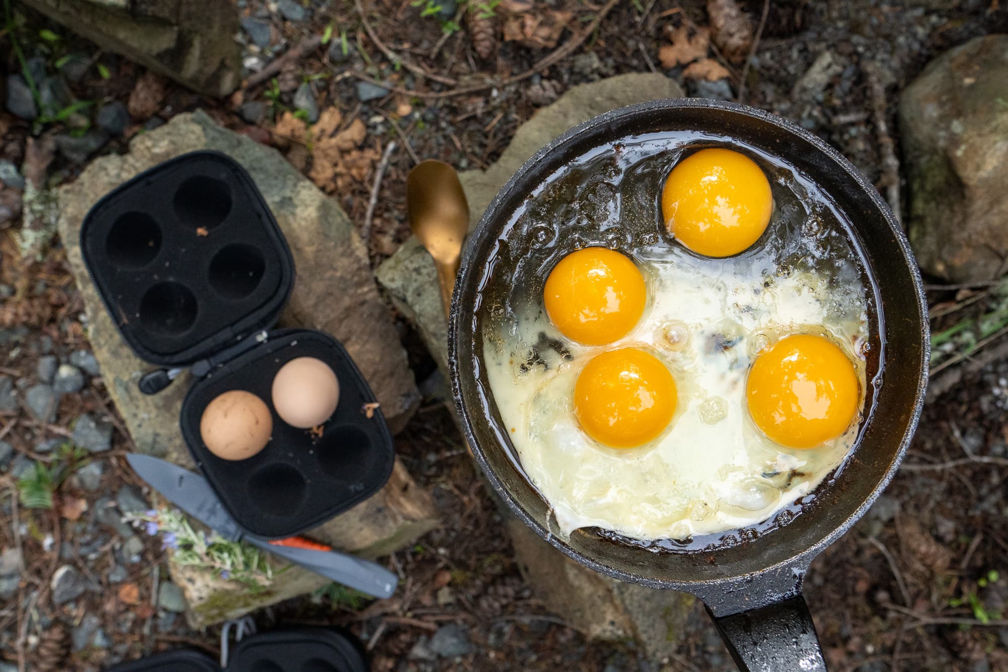Cooking eggs in the forest.