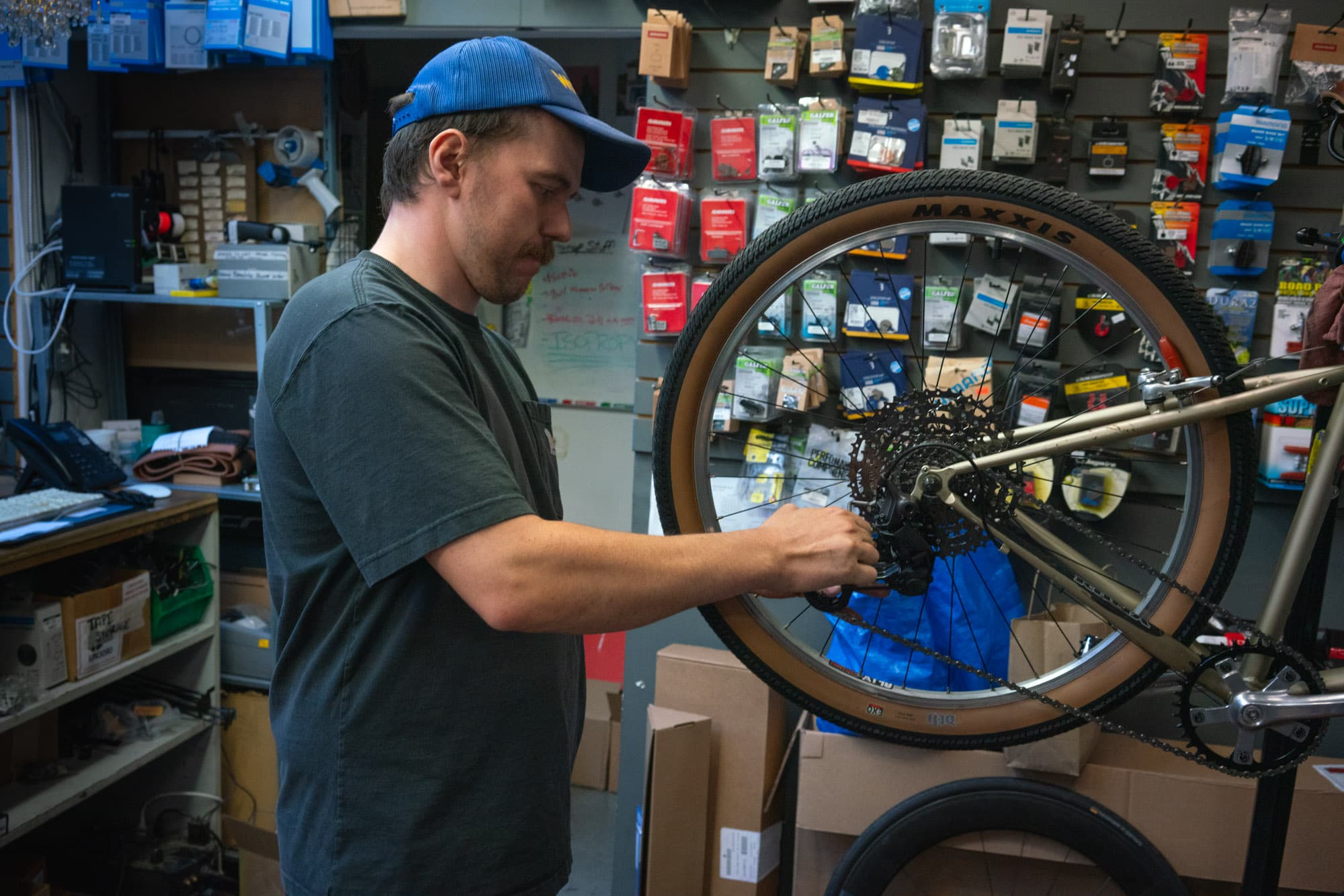 Adam pulls some cranks at Fort Street Cycles.