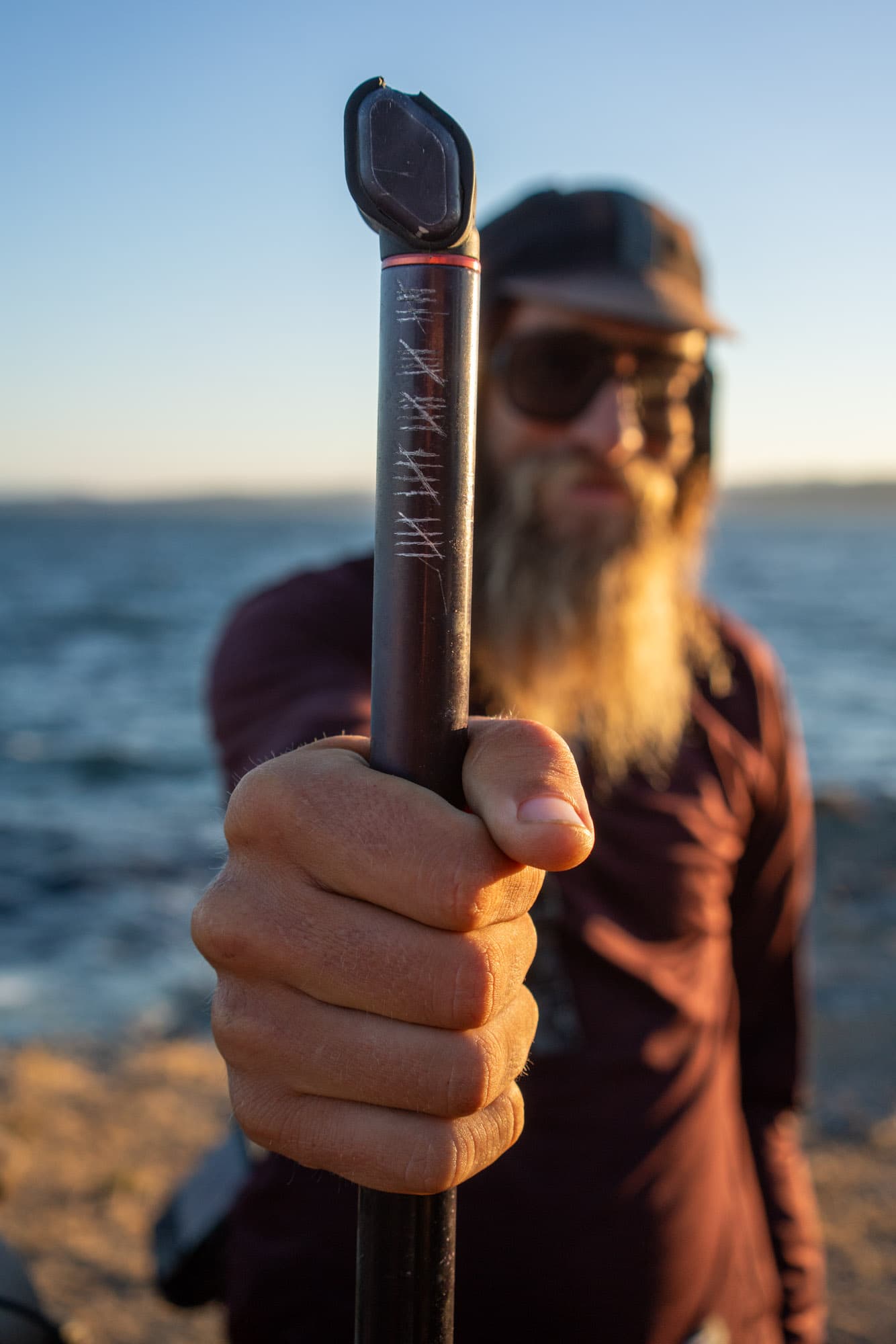 Erik keeps track of the number of flats with notches on his bike pump.