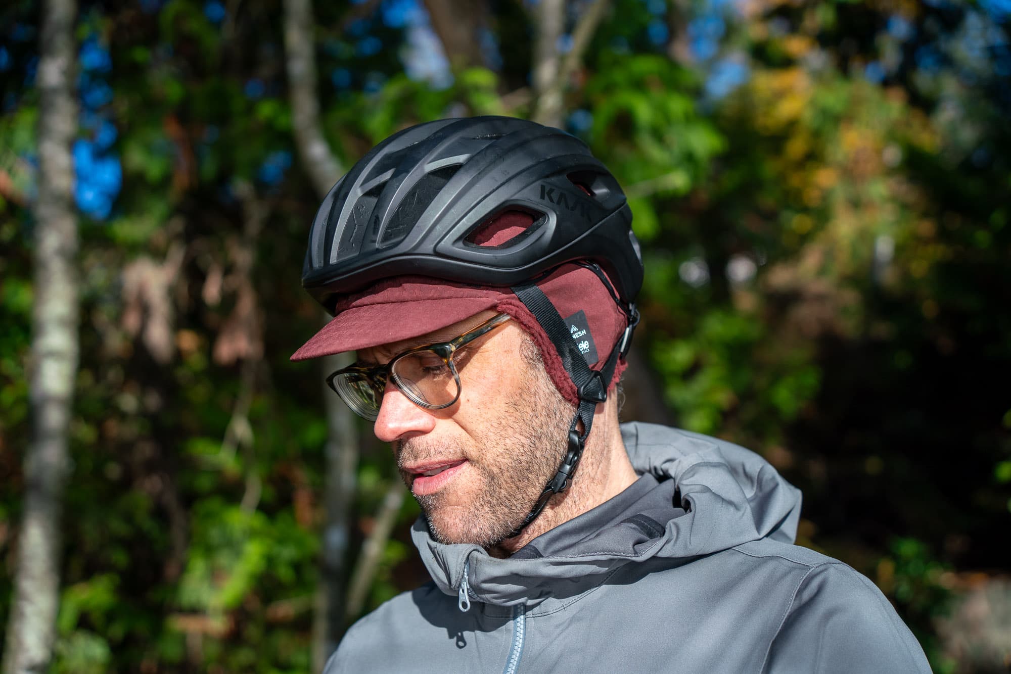 Barry models the cap in the forest.