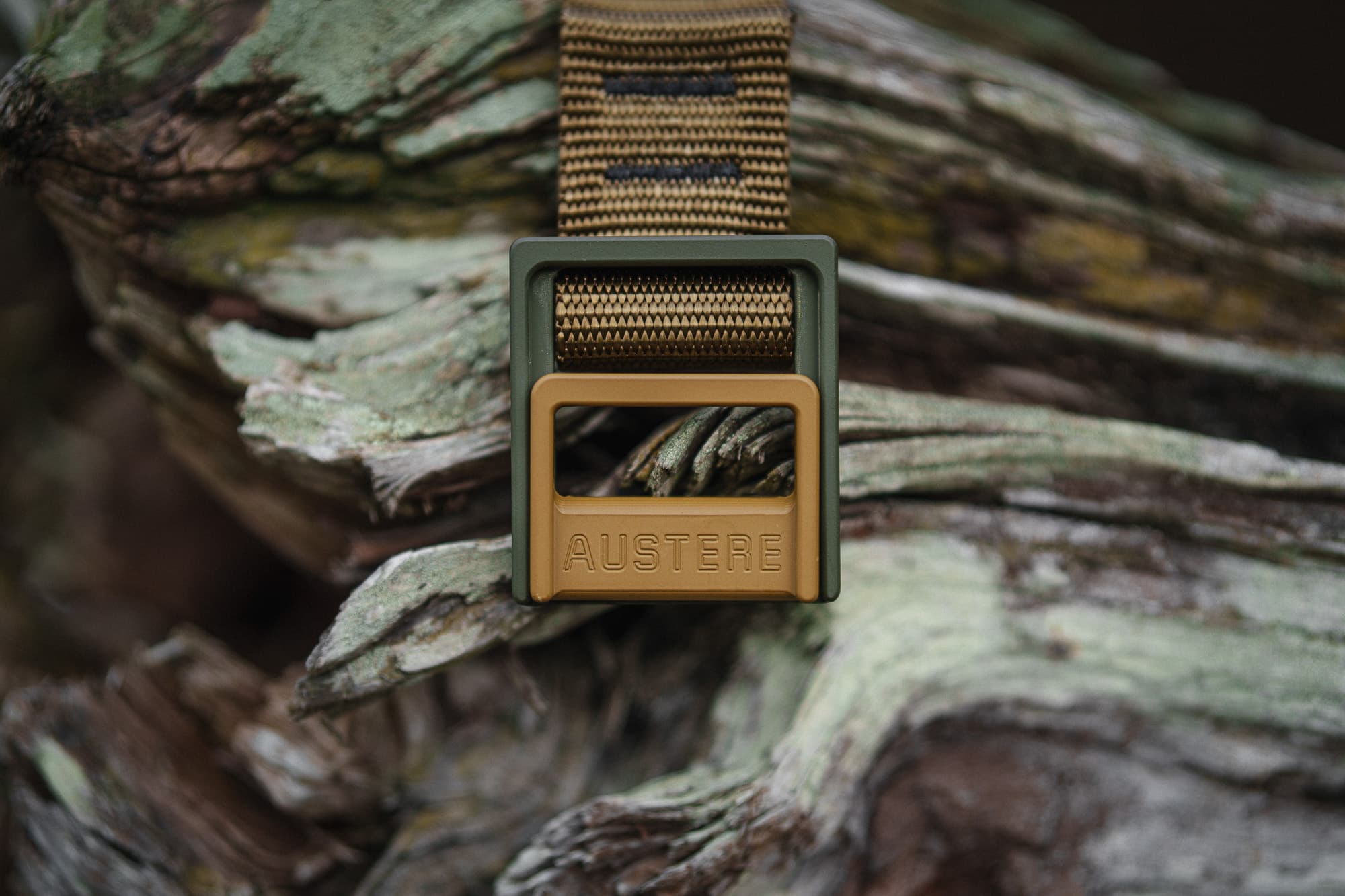 An Austere belt on driftwood.