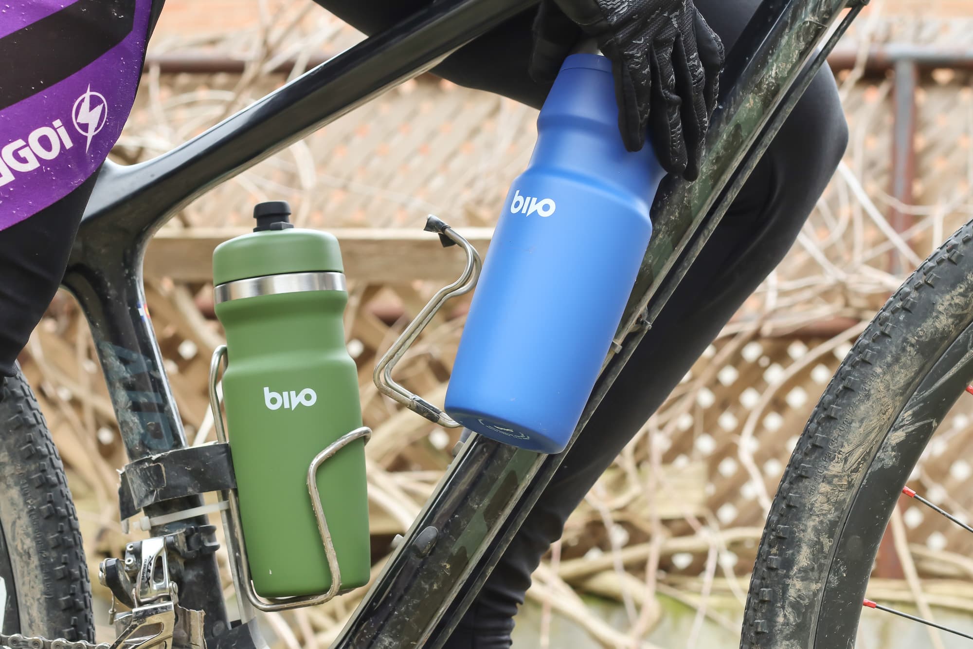 A rider goes fro a drink.