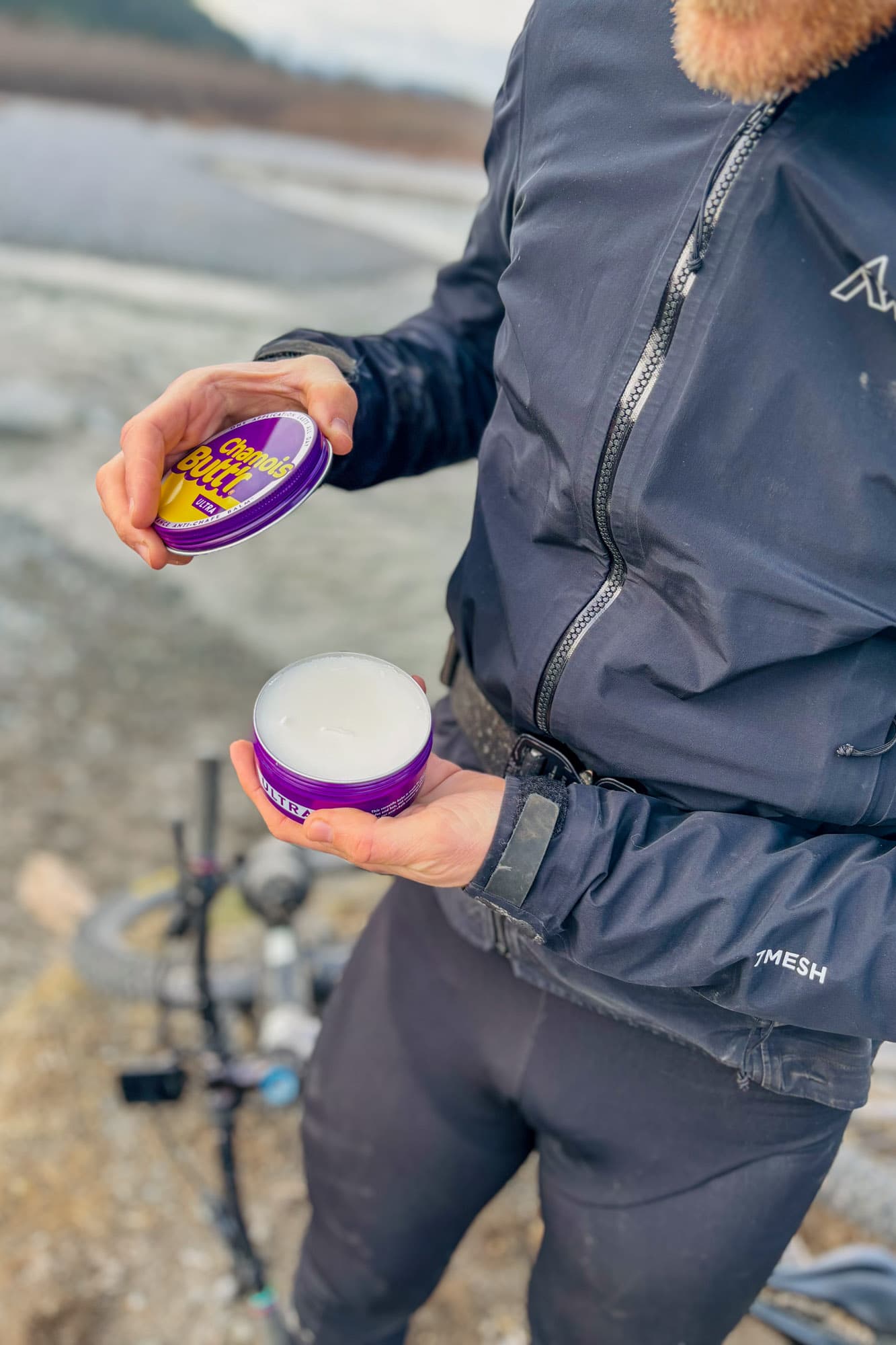 Alex opens his tin of Chamois Buttr.