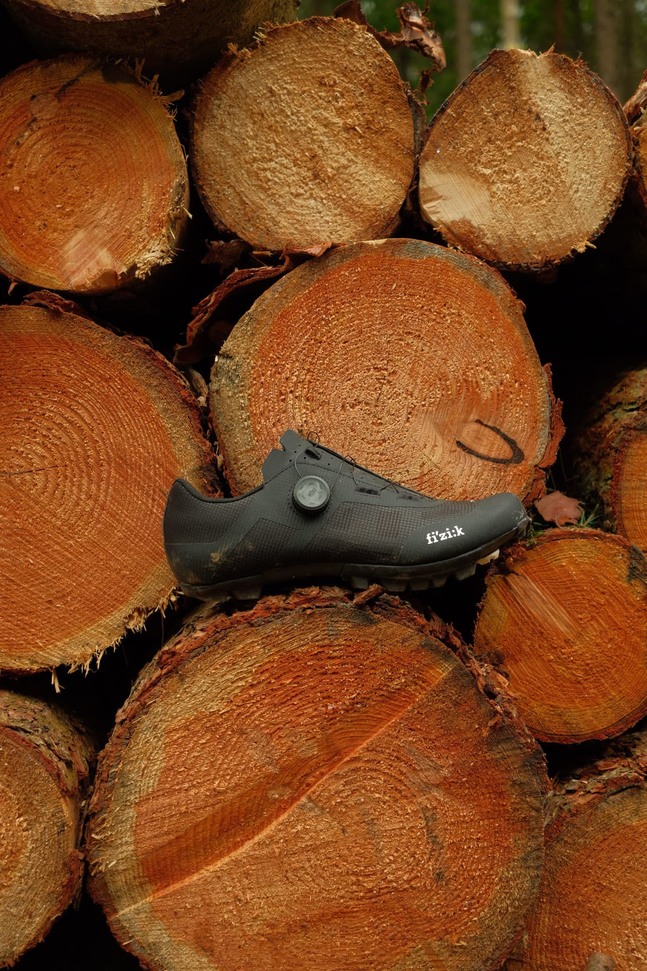 Fizik Vento Proxy side view on some logs.