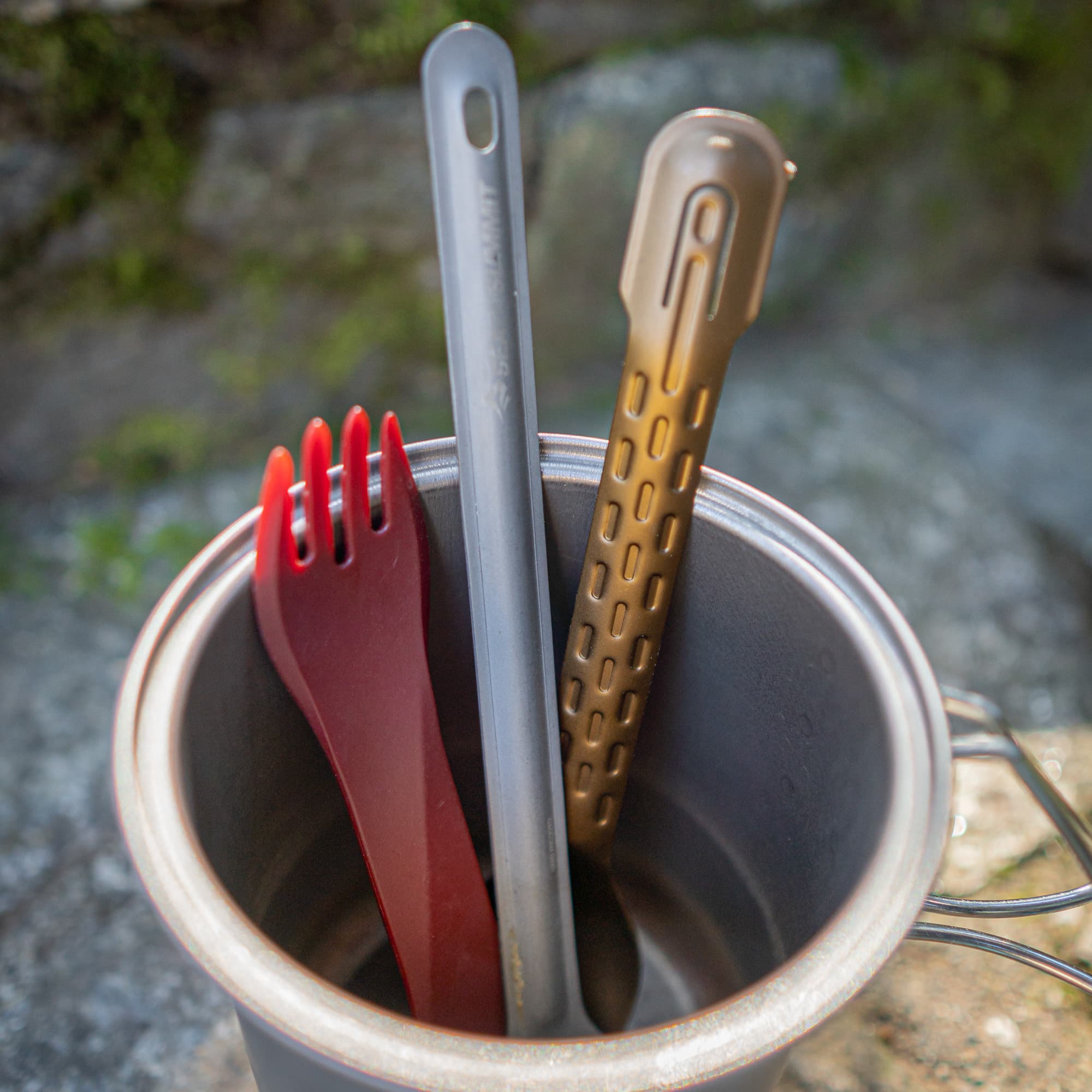 Sporks and the compleat set in a cook pot.