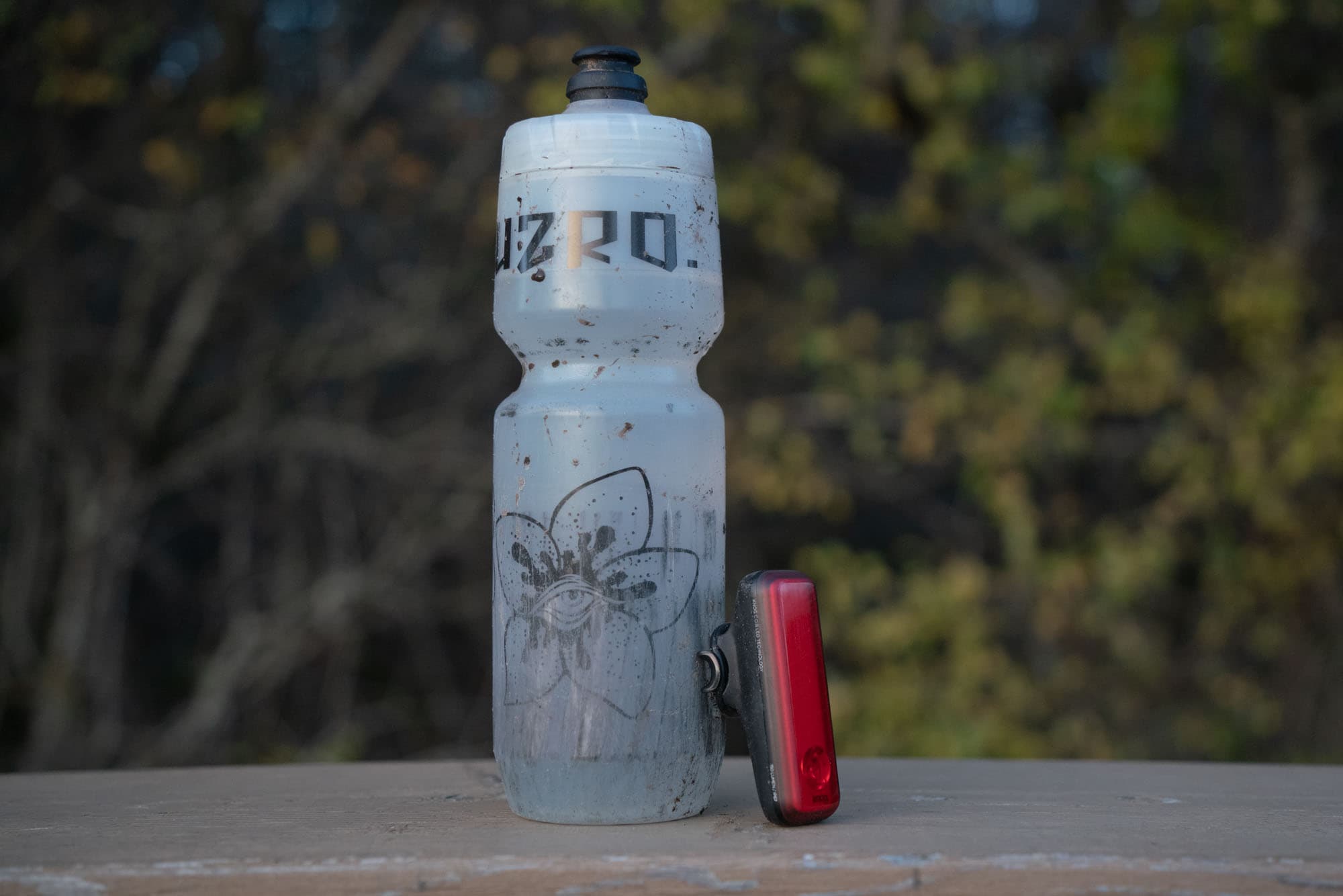 Blinder R-150 compared to a bottle.