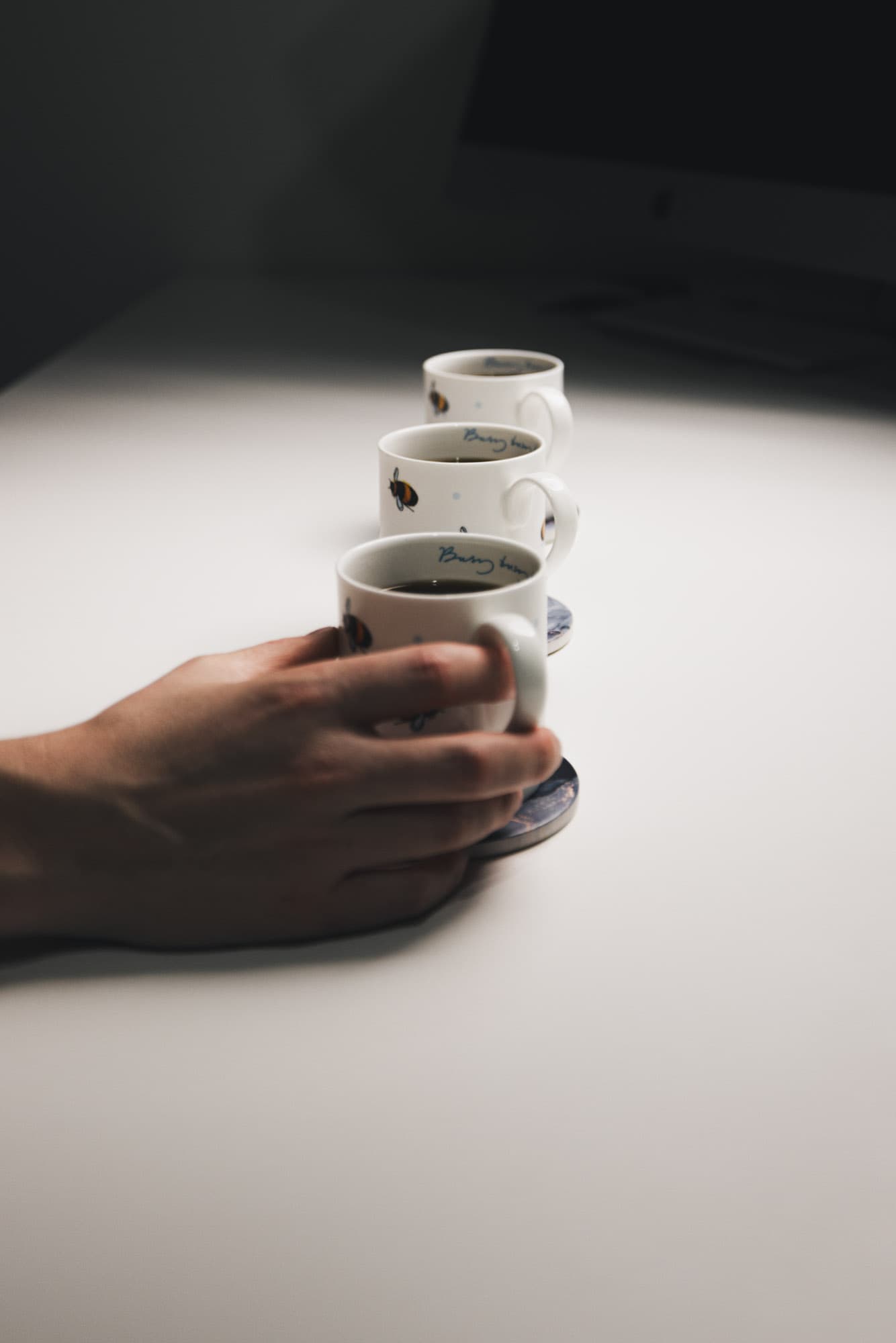 The three cups of coffeelined up.