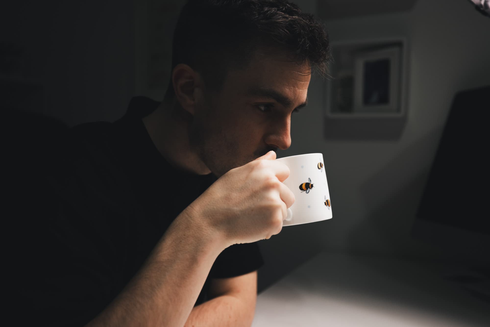 Lew takes a sip of No Normal Coffee.