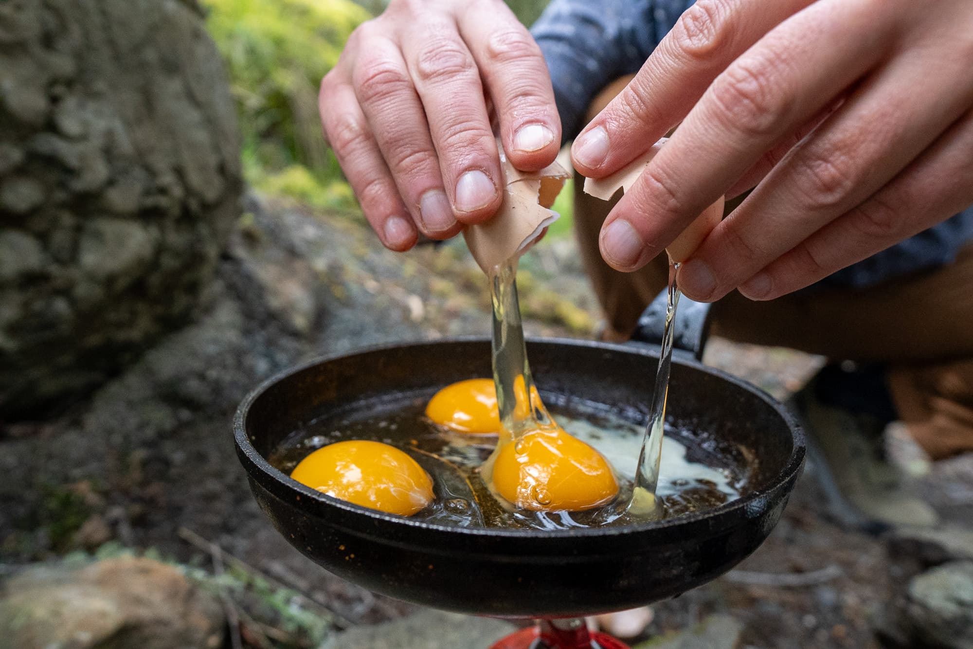 Barry cracks some eggs.