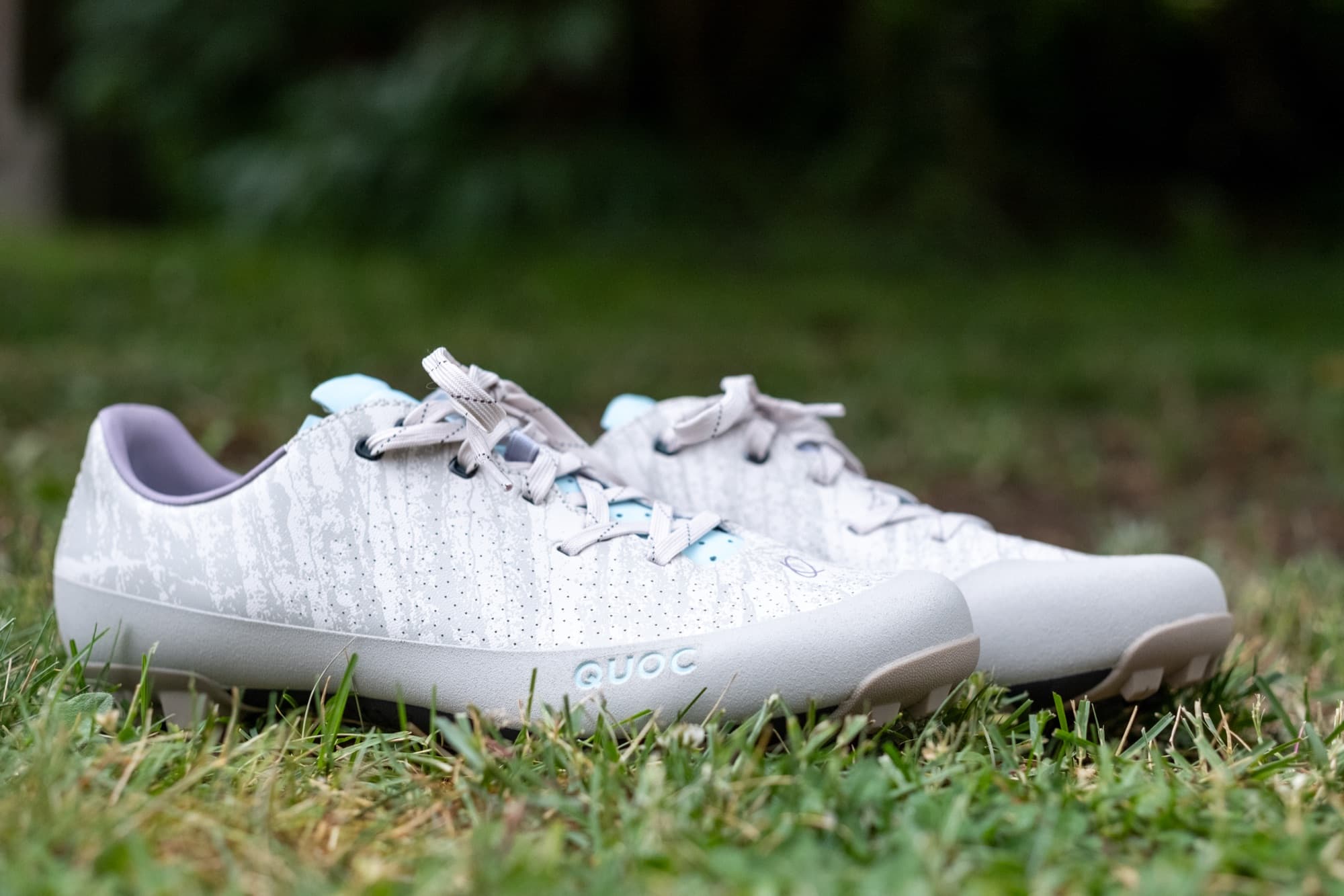 Smith x Quoc Gran Tourer XC Lace shoes sitting in the grass.