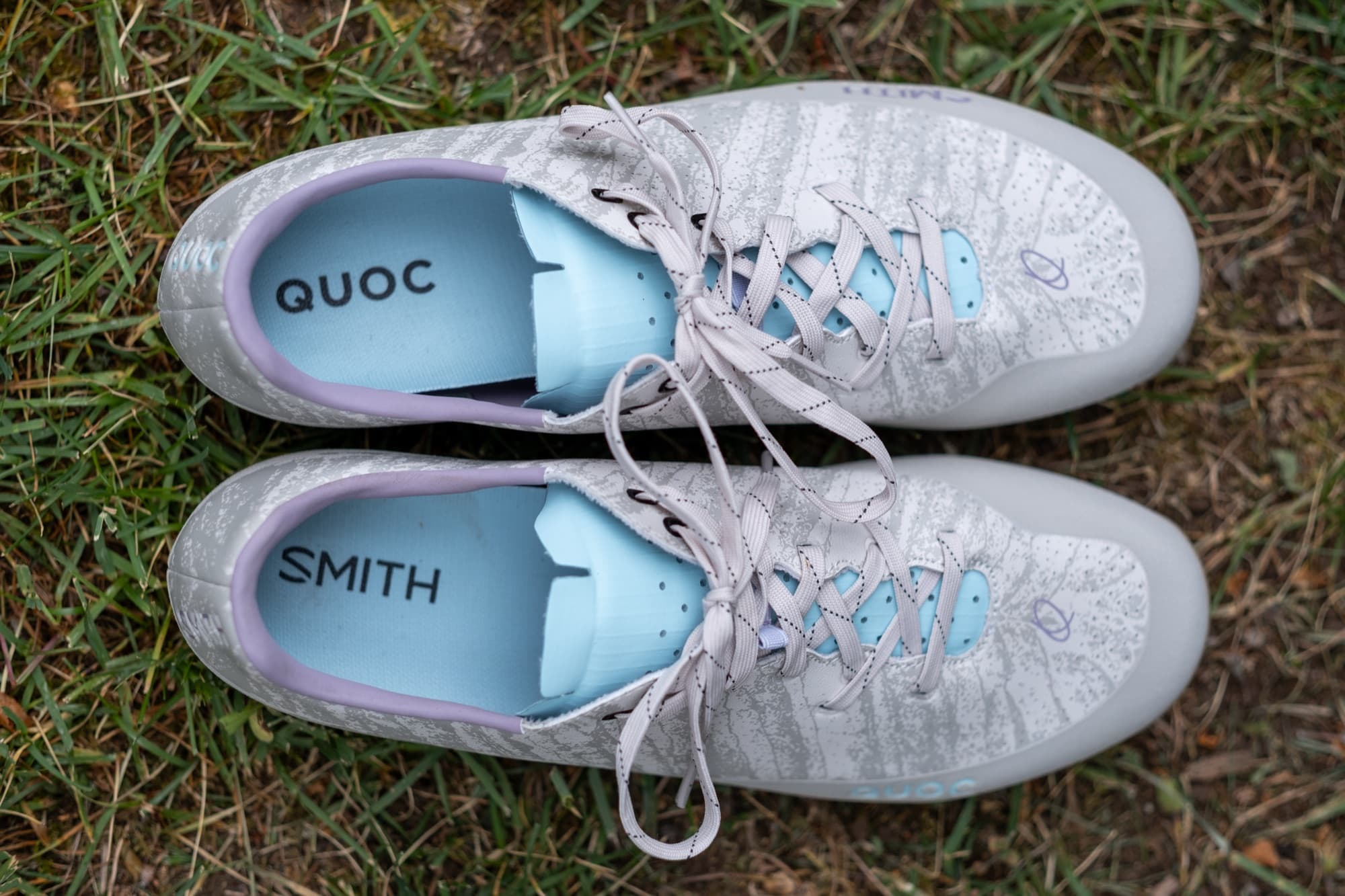 Top-down view of the Gran Tourer XC Lace shoes, showing the QUOC and SMITH insoles.