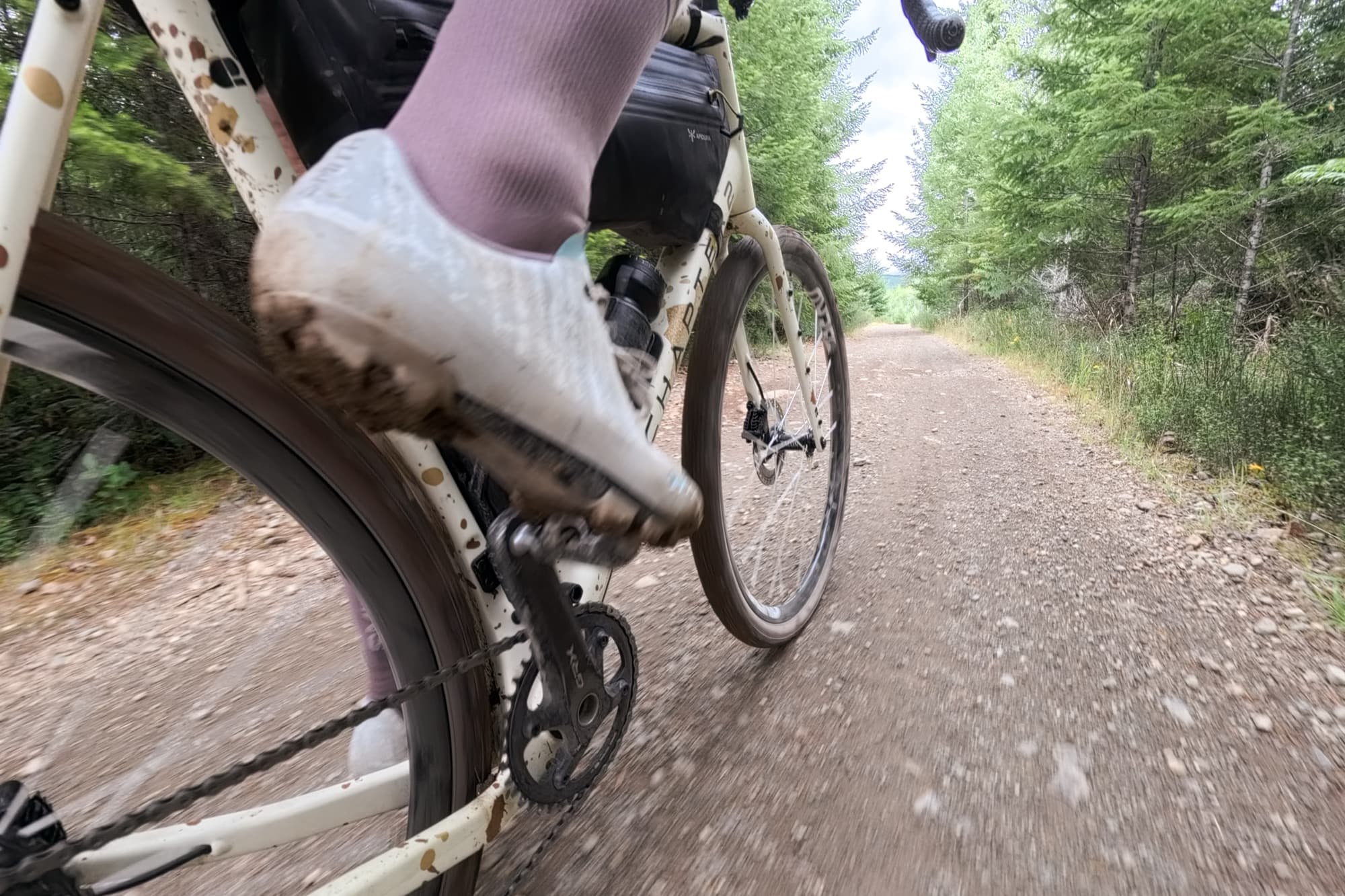 Jeff's Gran Tourer XC Lace clipped into the pedal while riding a gravel road.