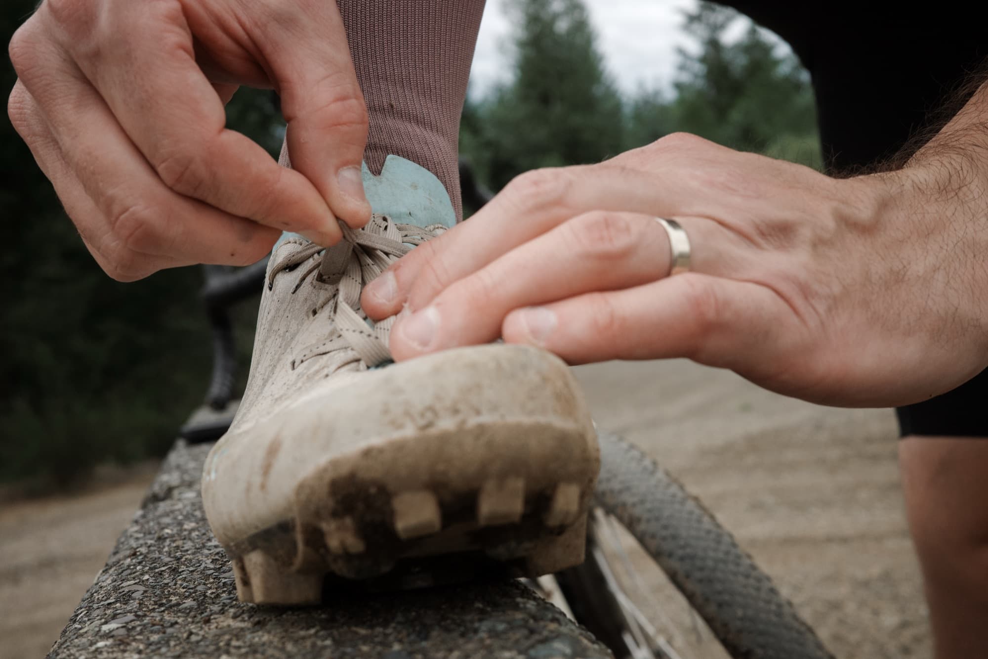 Tying off the laces before heading out on a ride.