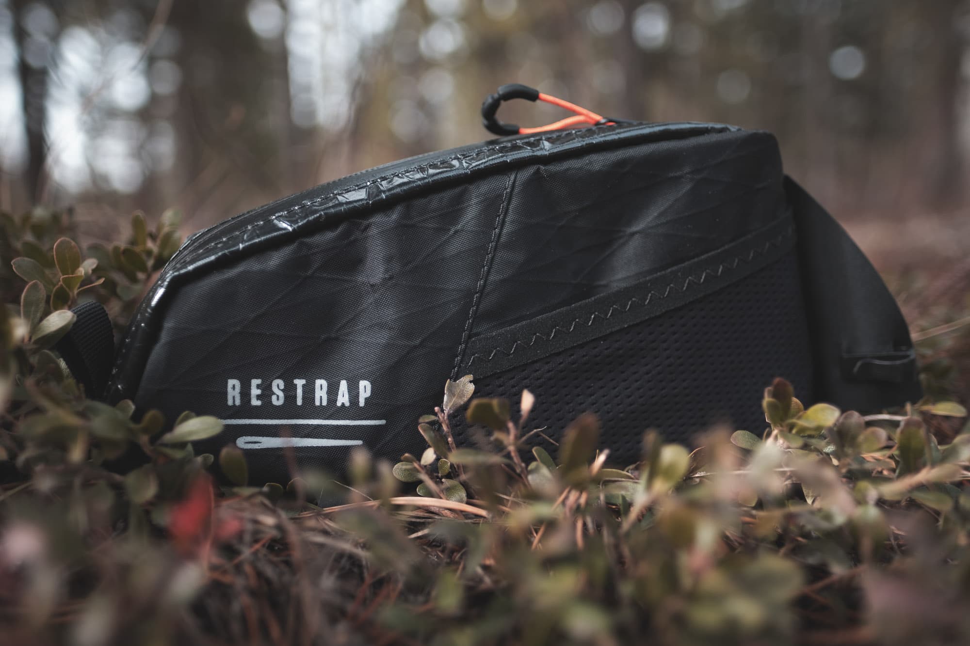 The Restrap Race bag in the forest.