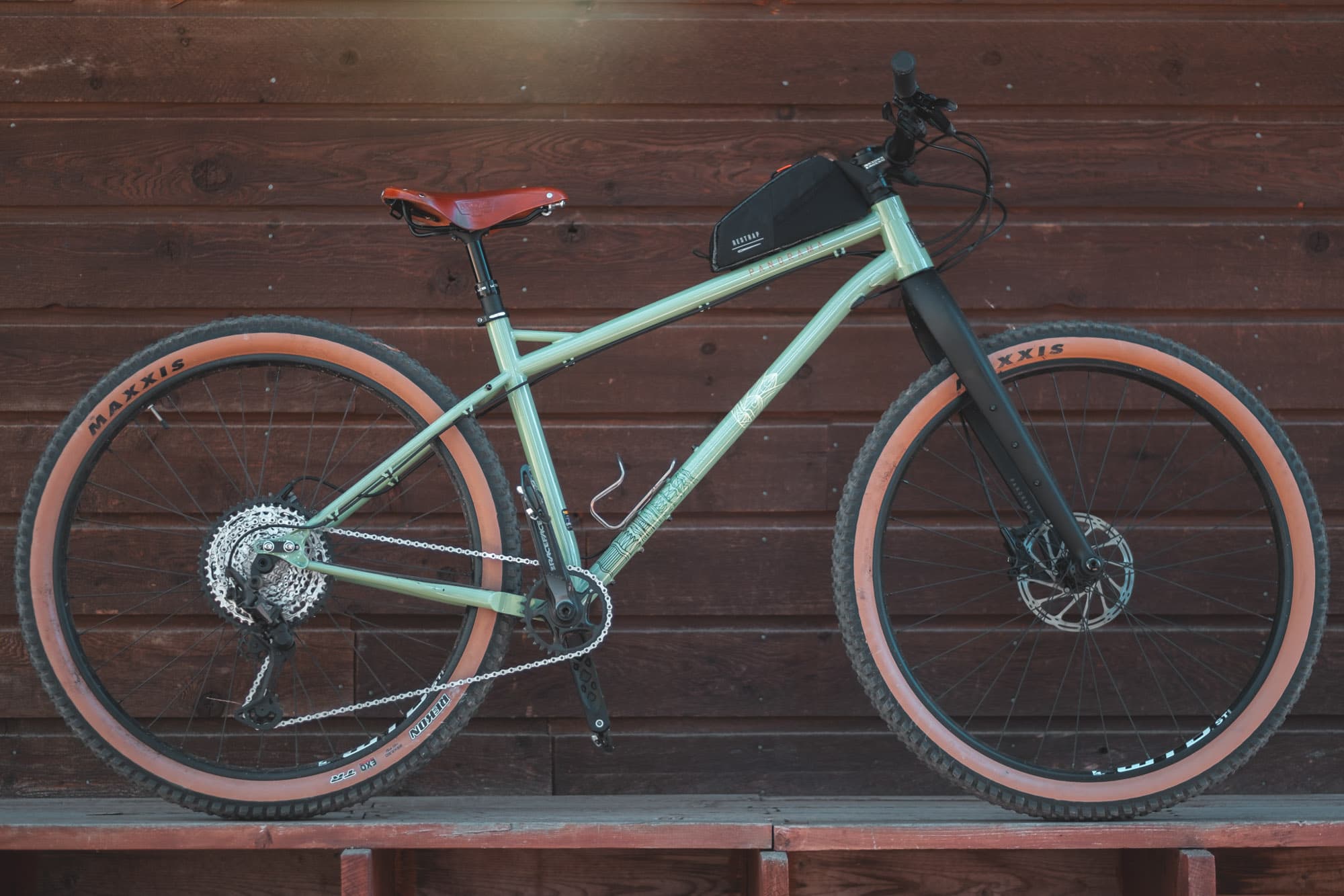 A mountain bike with a top tube bag.