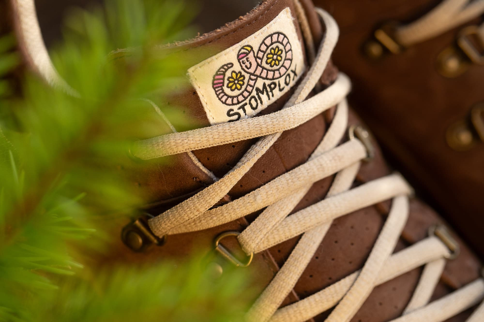 The Stomp Lox Trail Worm logo.