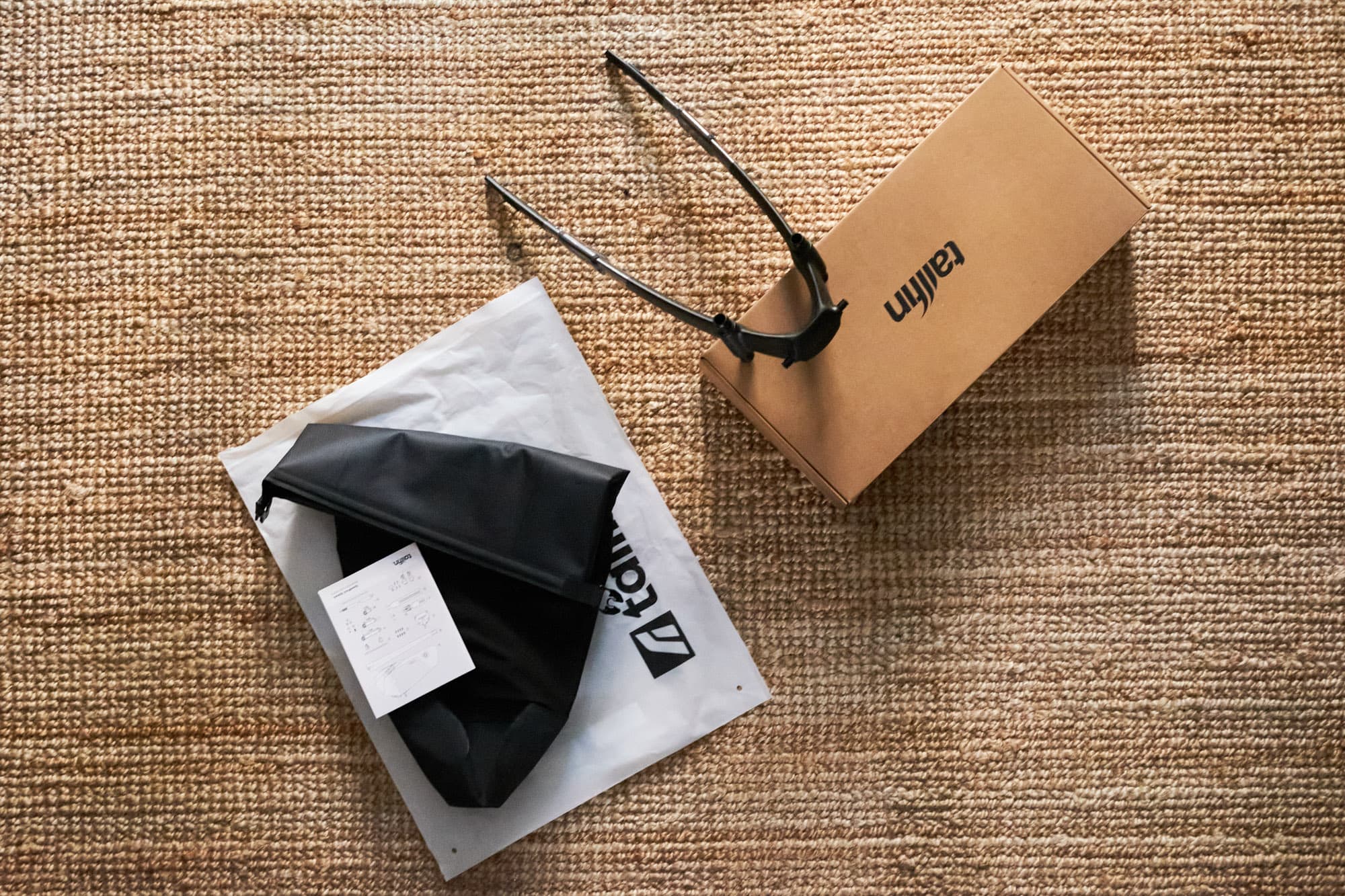 Tailfin SpeedPack unboxing on a woven mat.