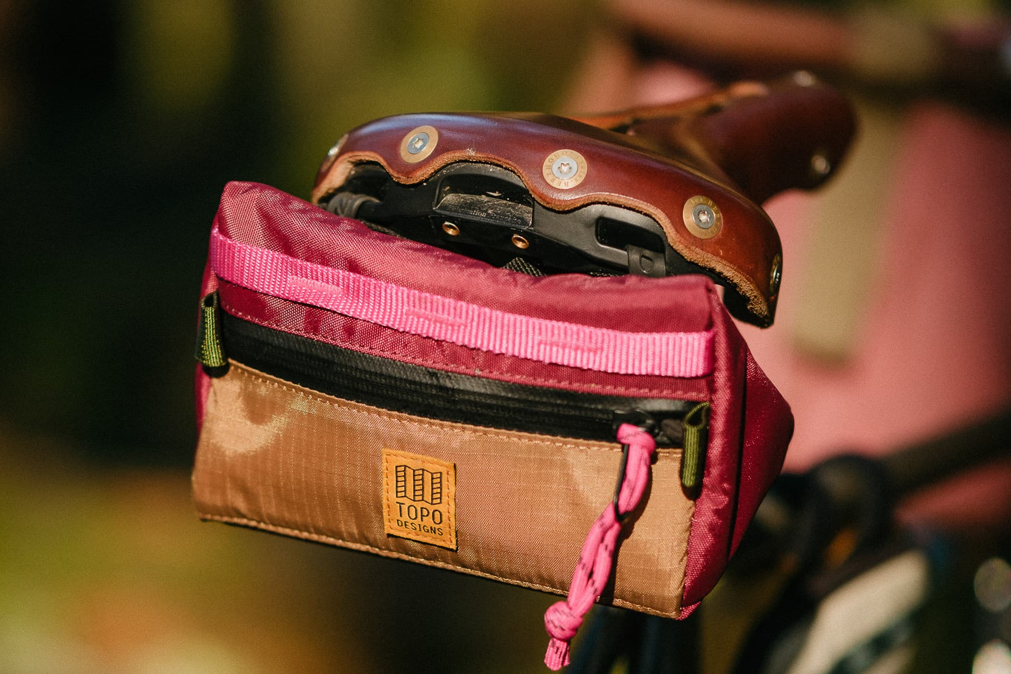 The Bike Bag mini on a leather saddle.