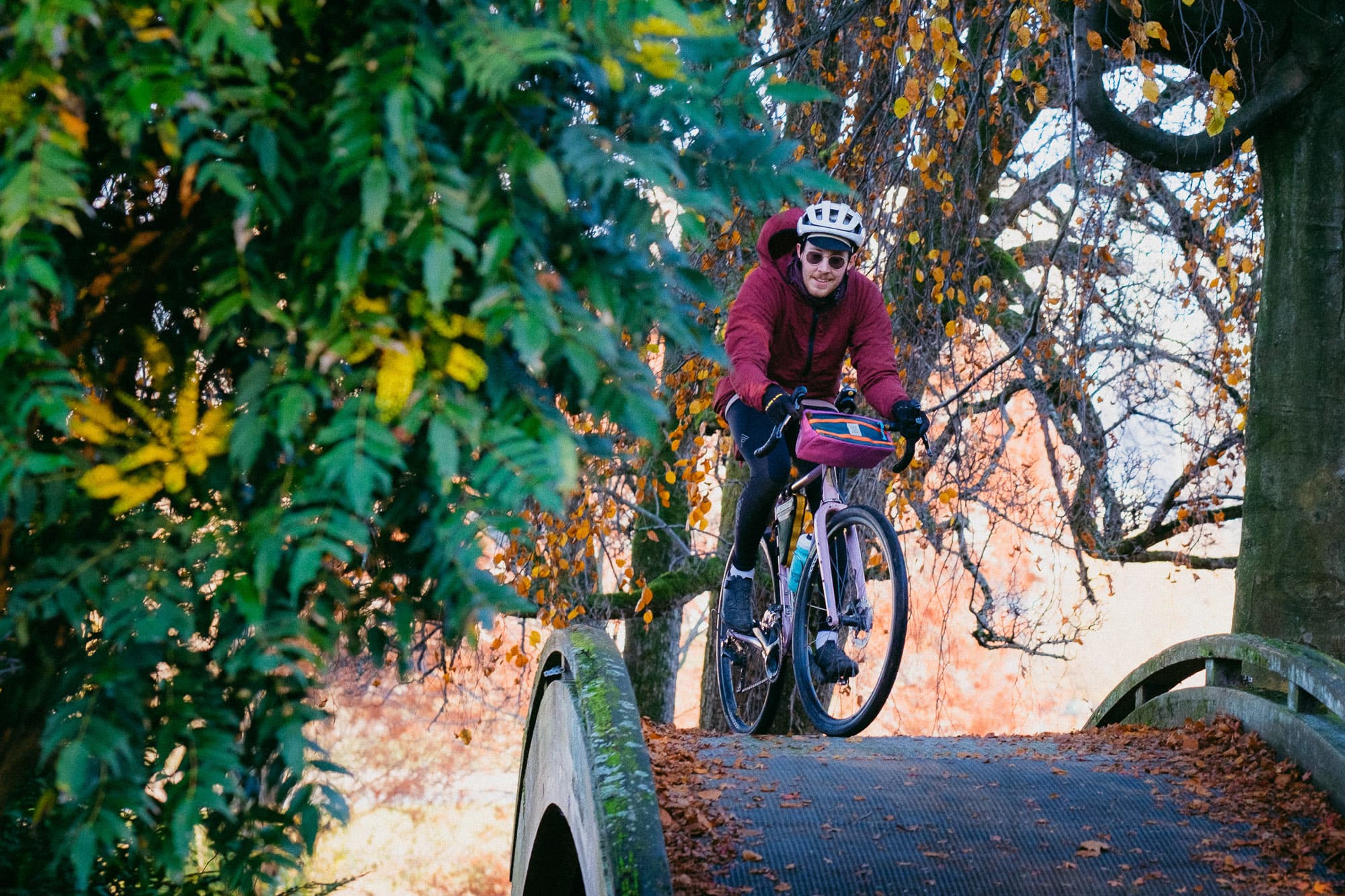 Over a wooden park bridge with Tpop Bike Bags.