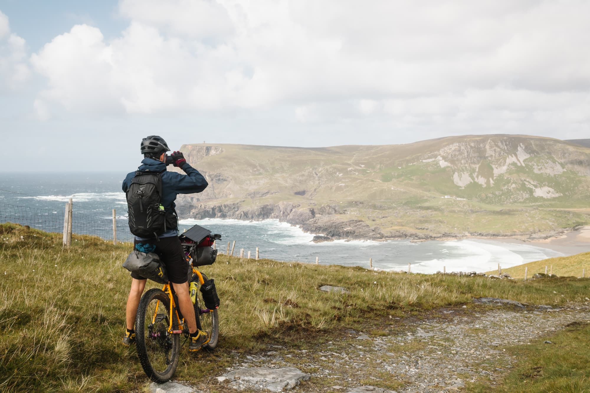 A rider pauses above the Atlantic on the coastal track