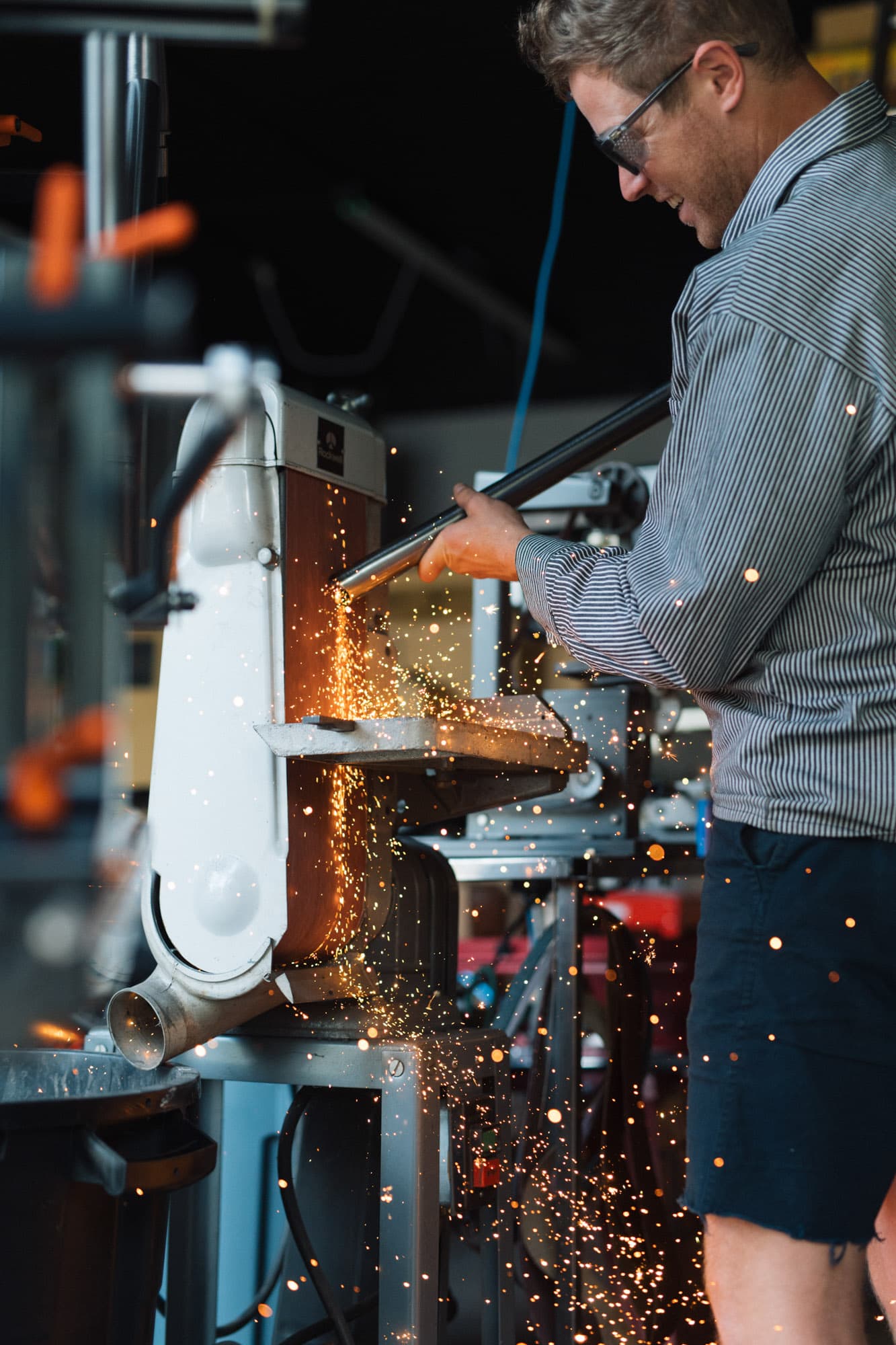 Adam grinds some steel.
