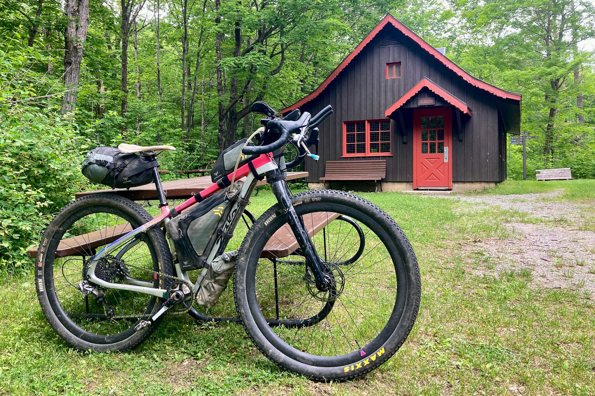 Meaghans Salsa in front of a cabin.