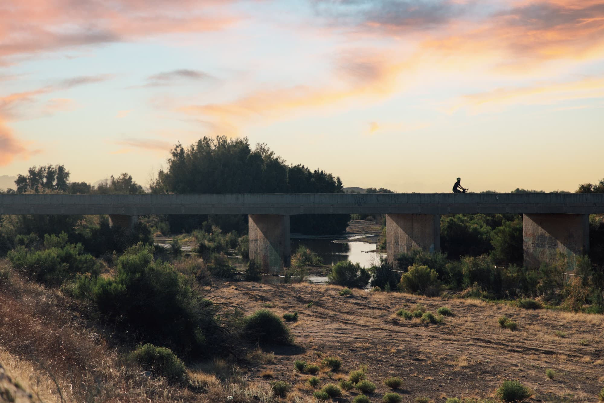 Erik goes over a bridge in the States.