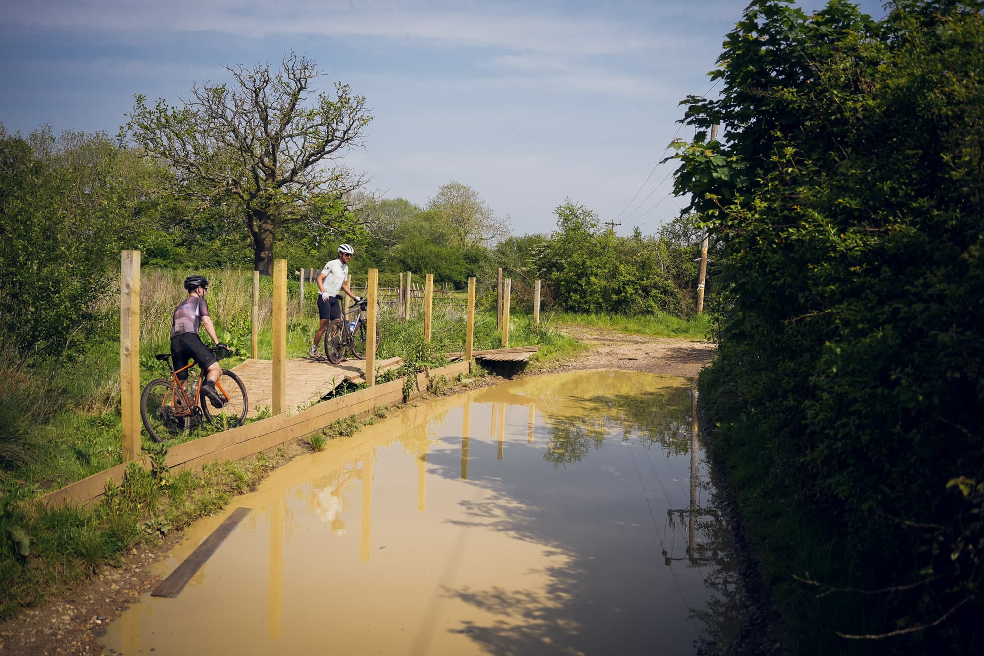 Riders face a water obstacle.