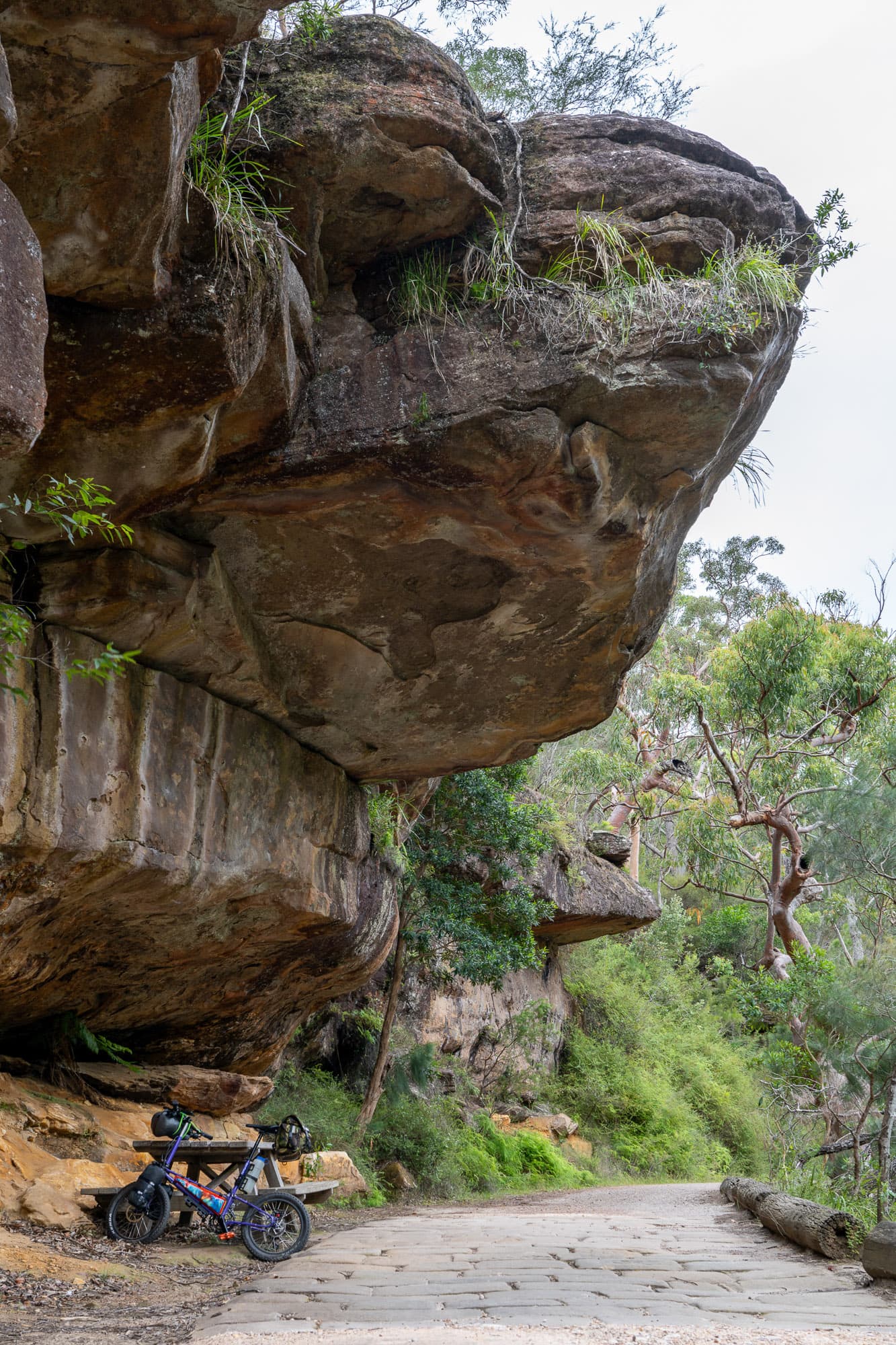 The Bike Friday under an overhanging rock.