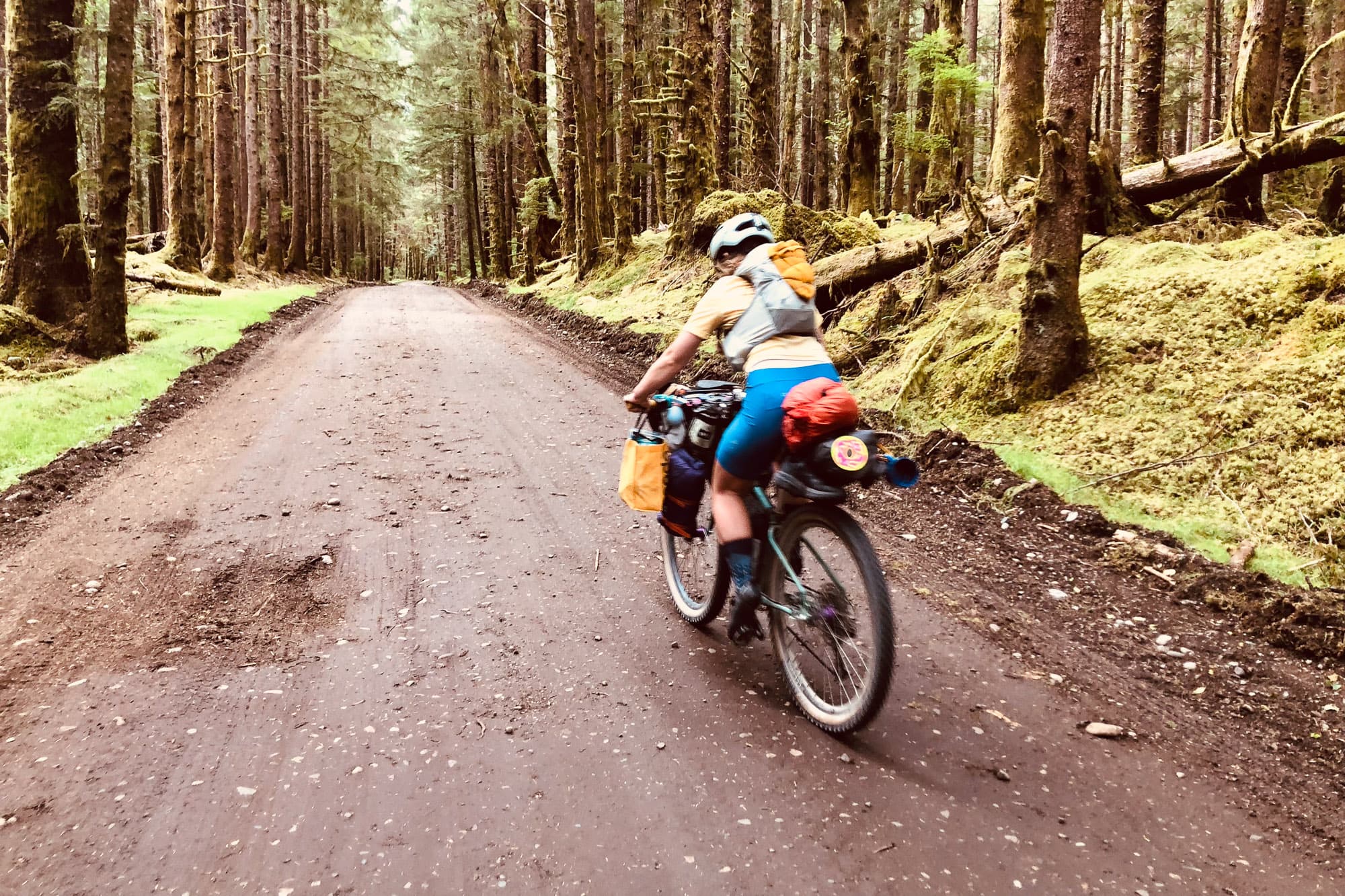 Sarah rides her bikes down the dirt roads.