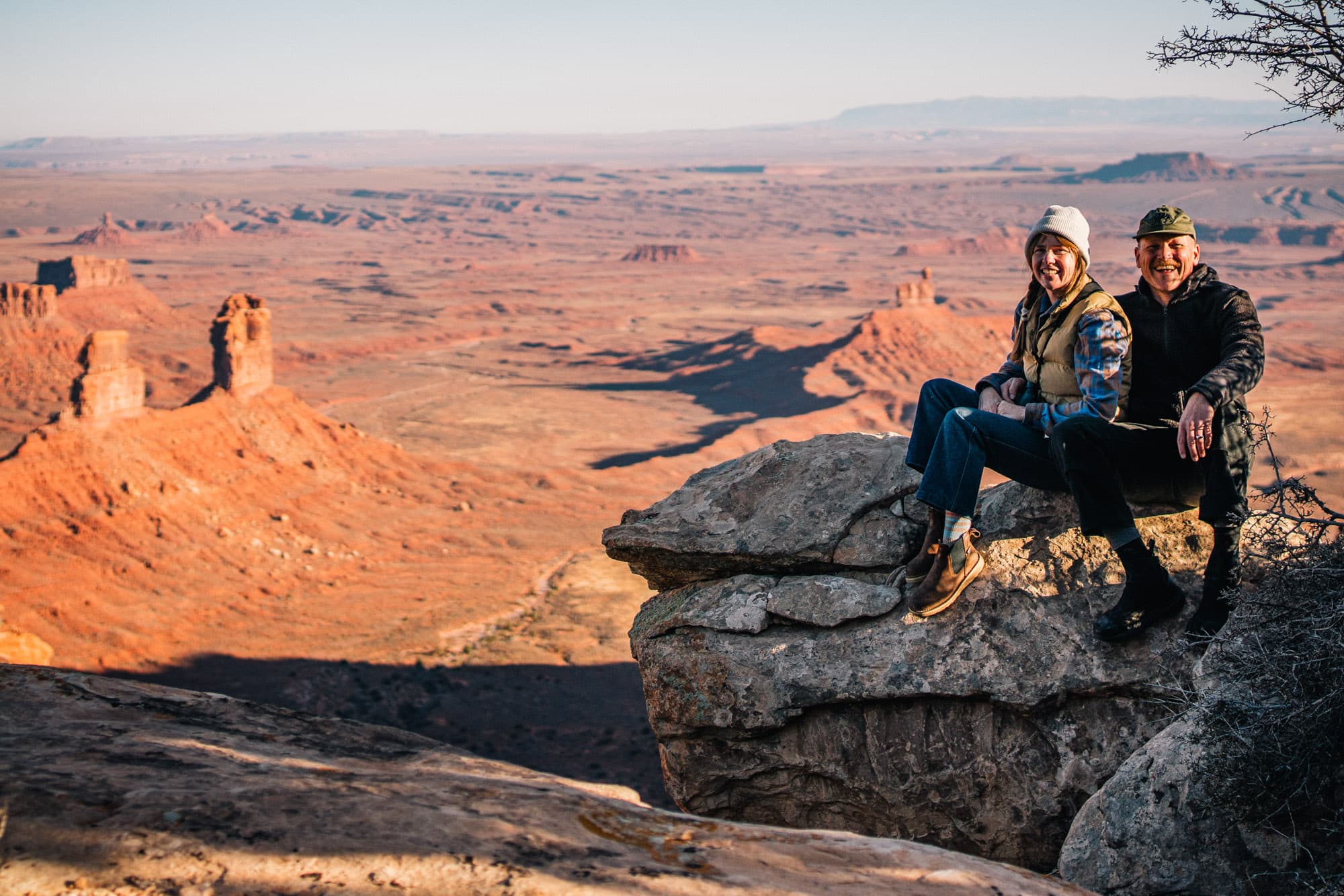 John and Cari sitting in front of a valley.
