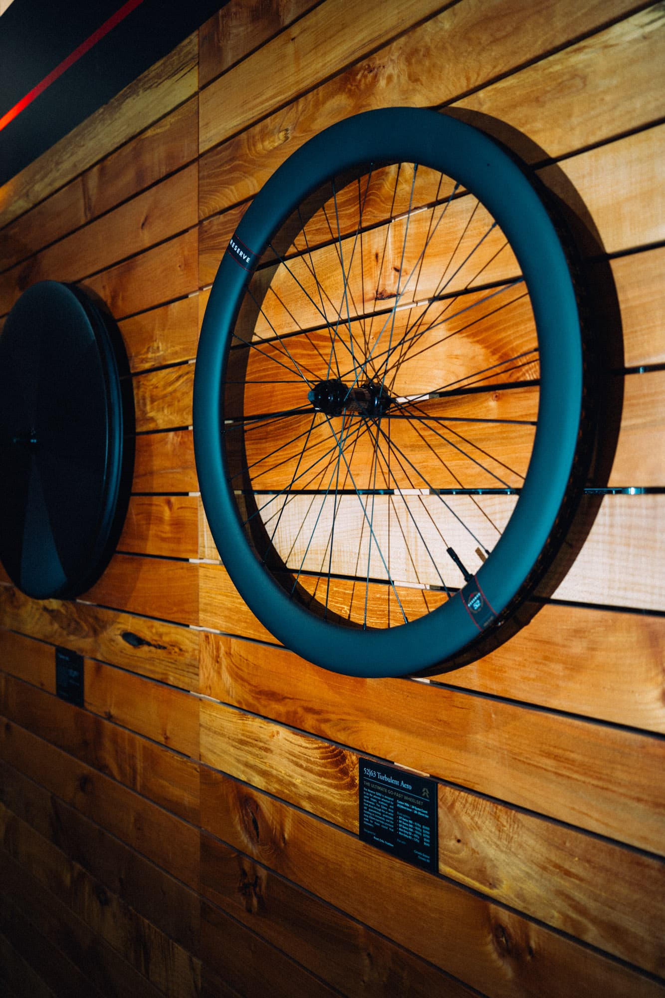 Carbon bike wheels on a wall.