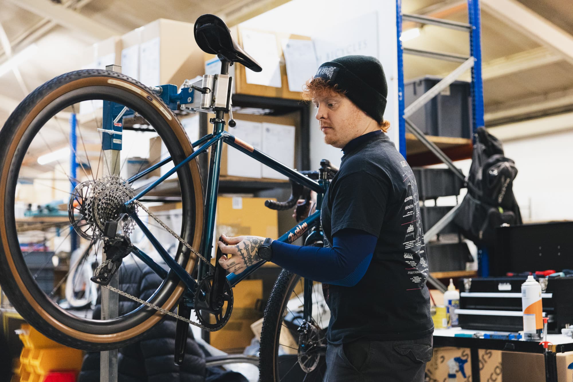 A worker preps a bike.