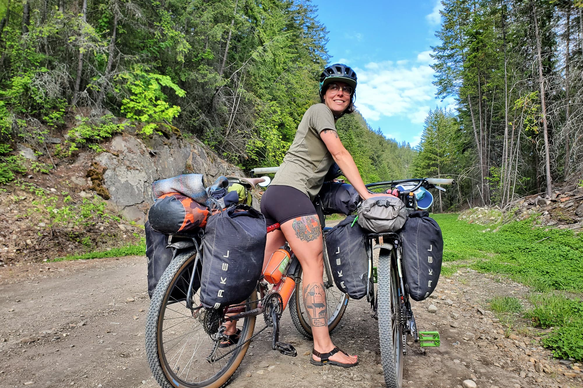 Ali holding up the bikes.