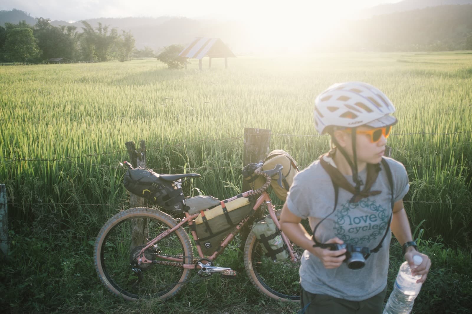 Woman Taking a Break Near Rice Field