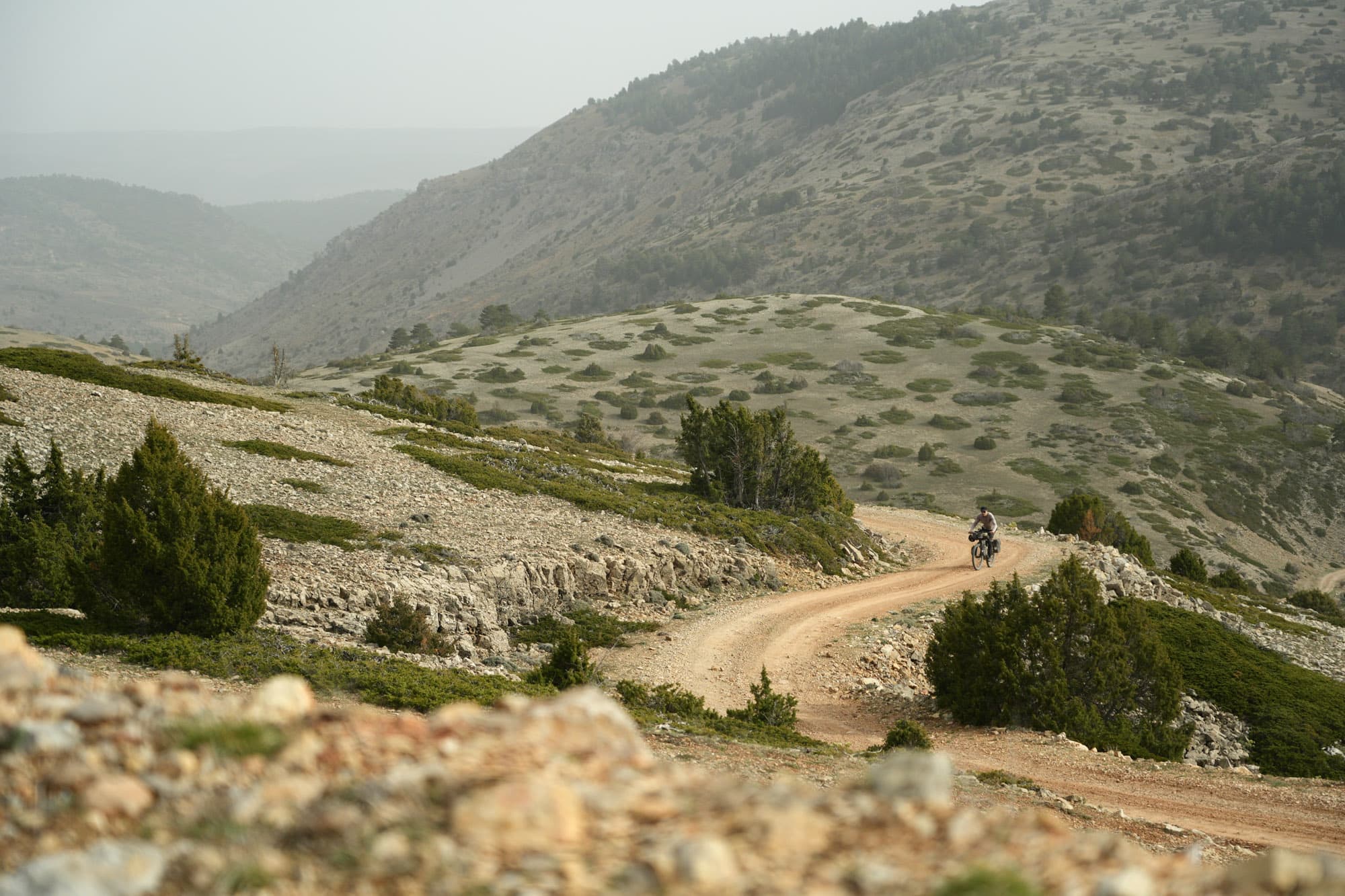 Tristan rides a dusty road.