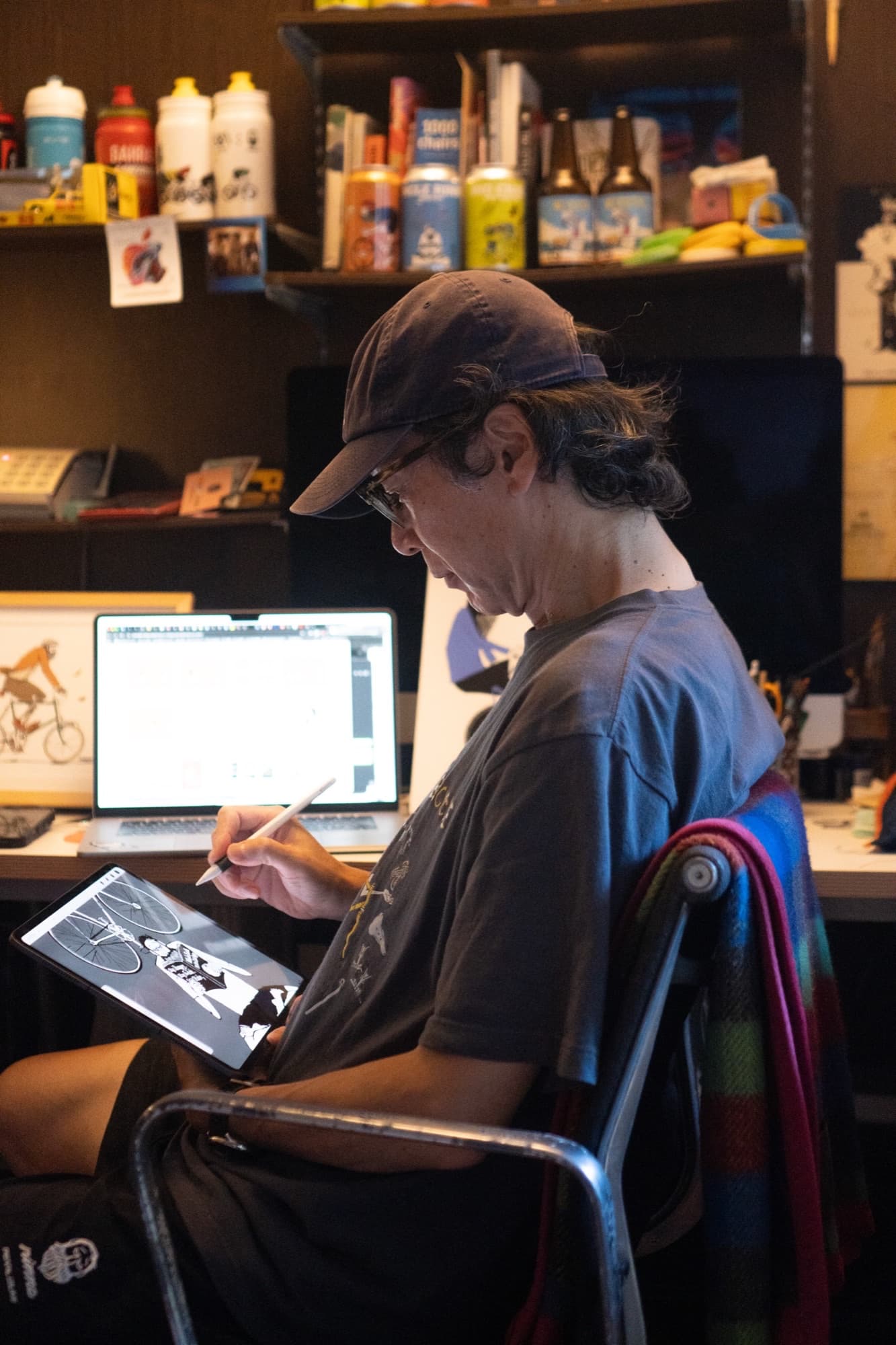Tetsuro Ohno drawing Uncle Rinne on an iPad at his desk