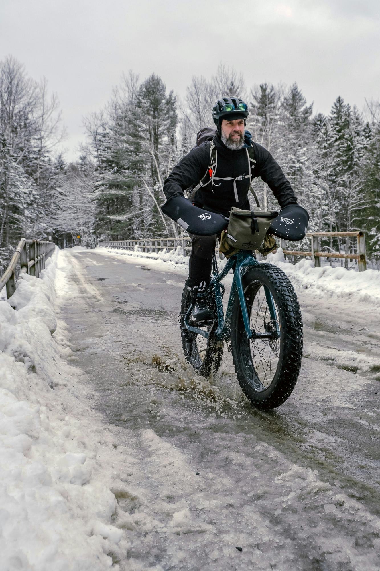 He rides in the slush and the snow. Nothing can stop him.