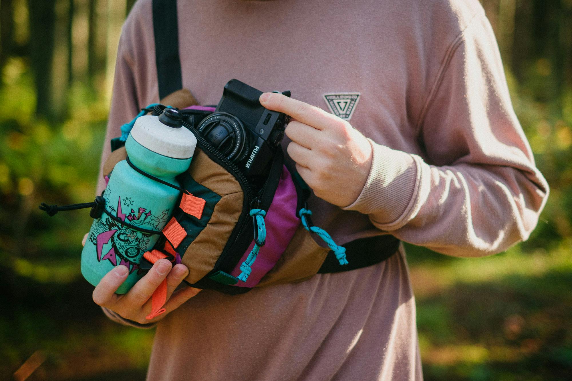 The hip pack loaded with a bottle and camera.
