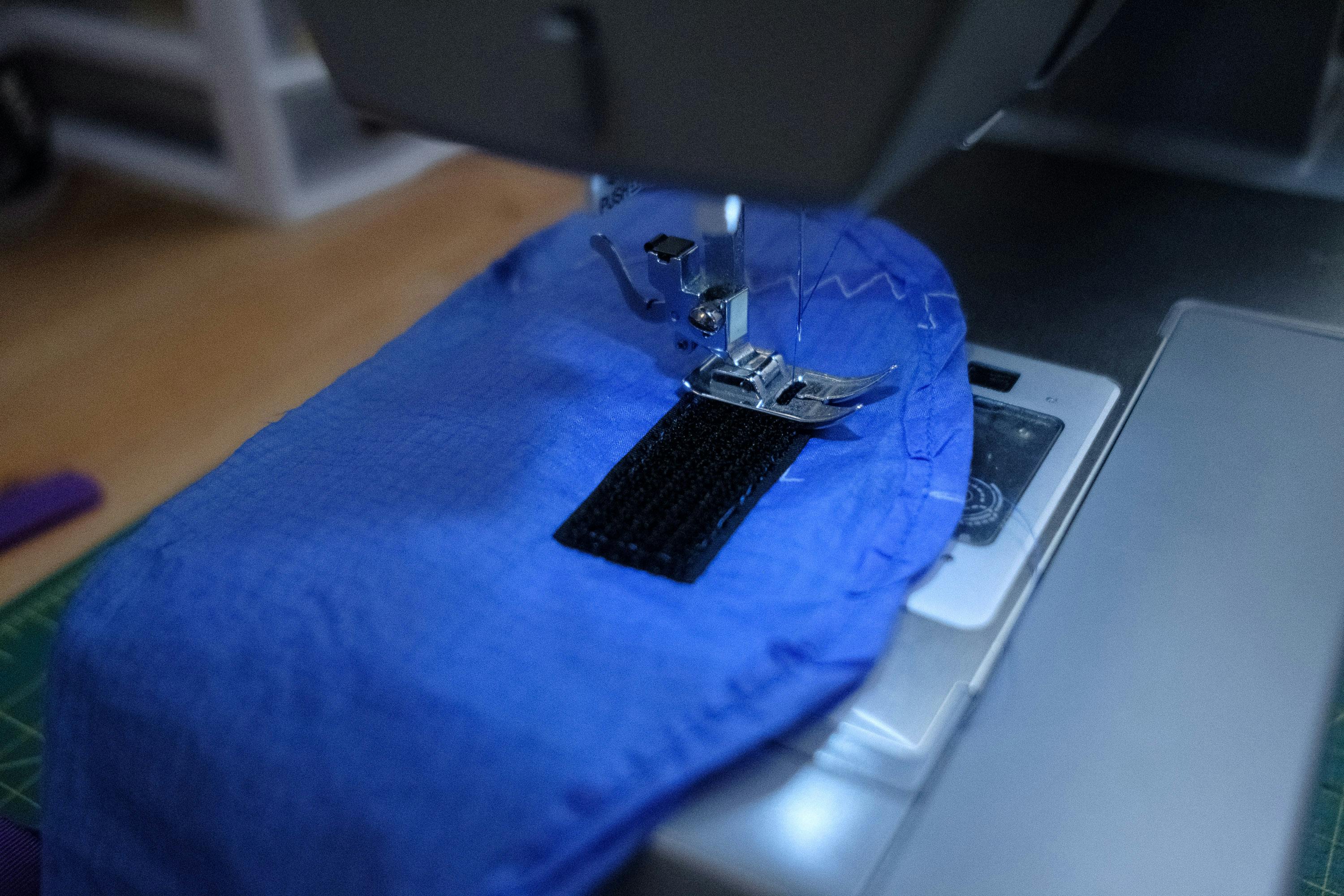 Stitching in the velcro.