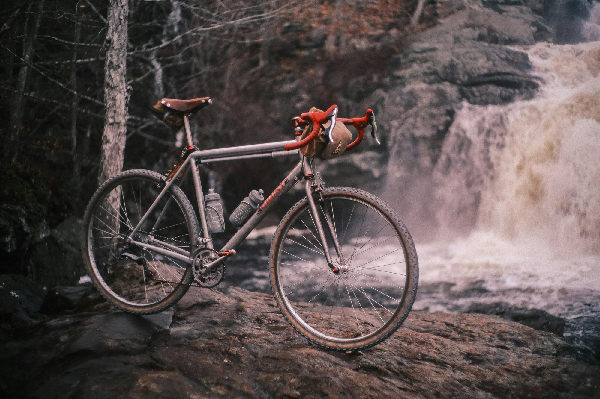 Ronnies Crust bike near a waterfall.