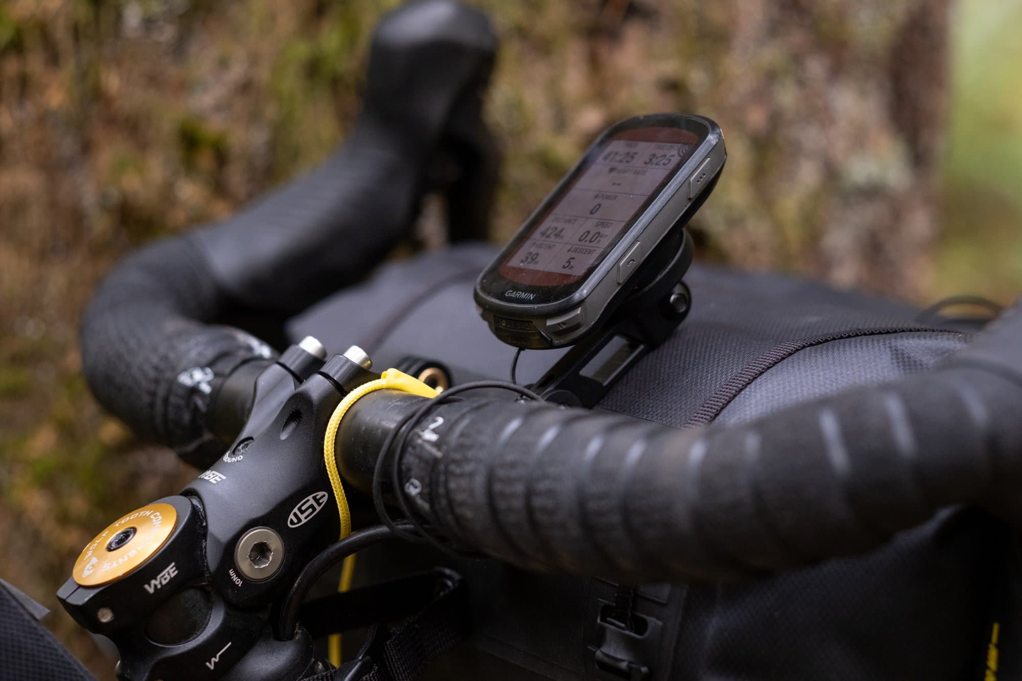 A Garmin head unit on the Handlebar Pack's 3-prong mount.