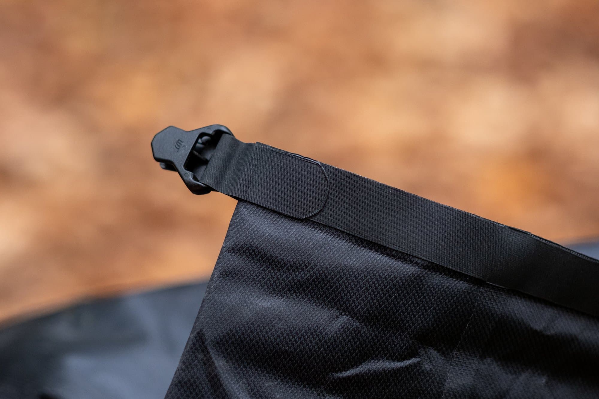 The Handlebar Pack's roll-top closure and its single hook.