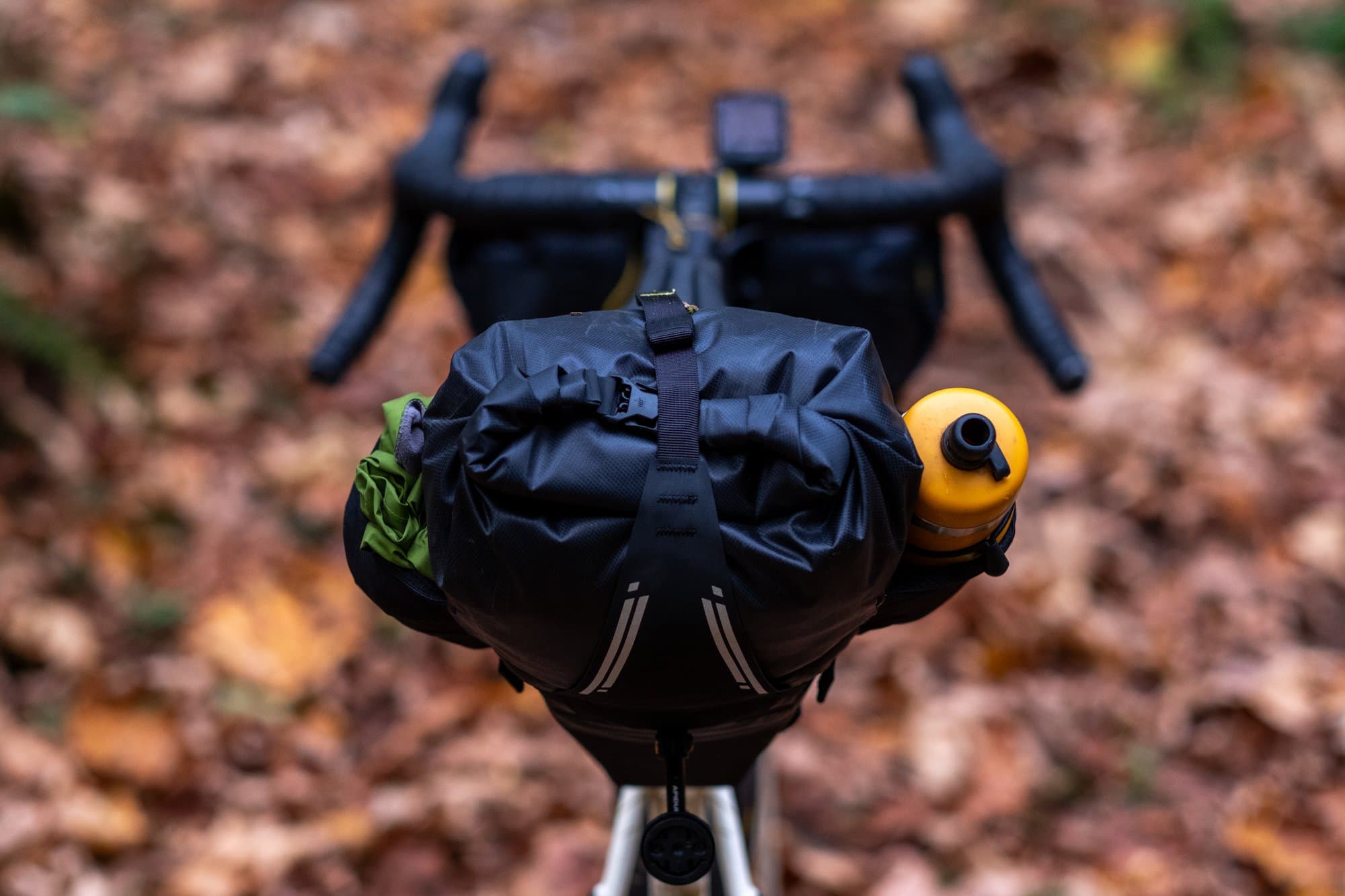 The Saddle Pack from behind, a bottle tucked in its mesh side pocket.