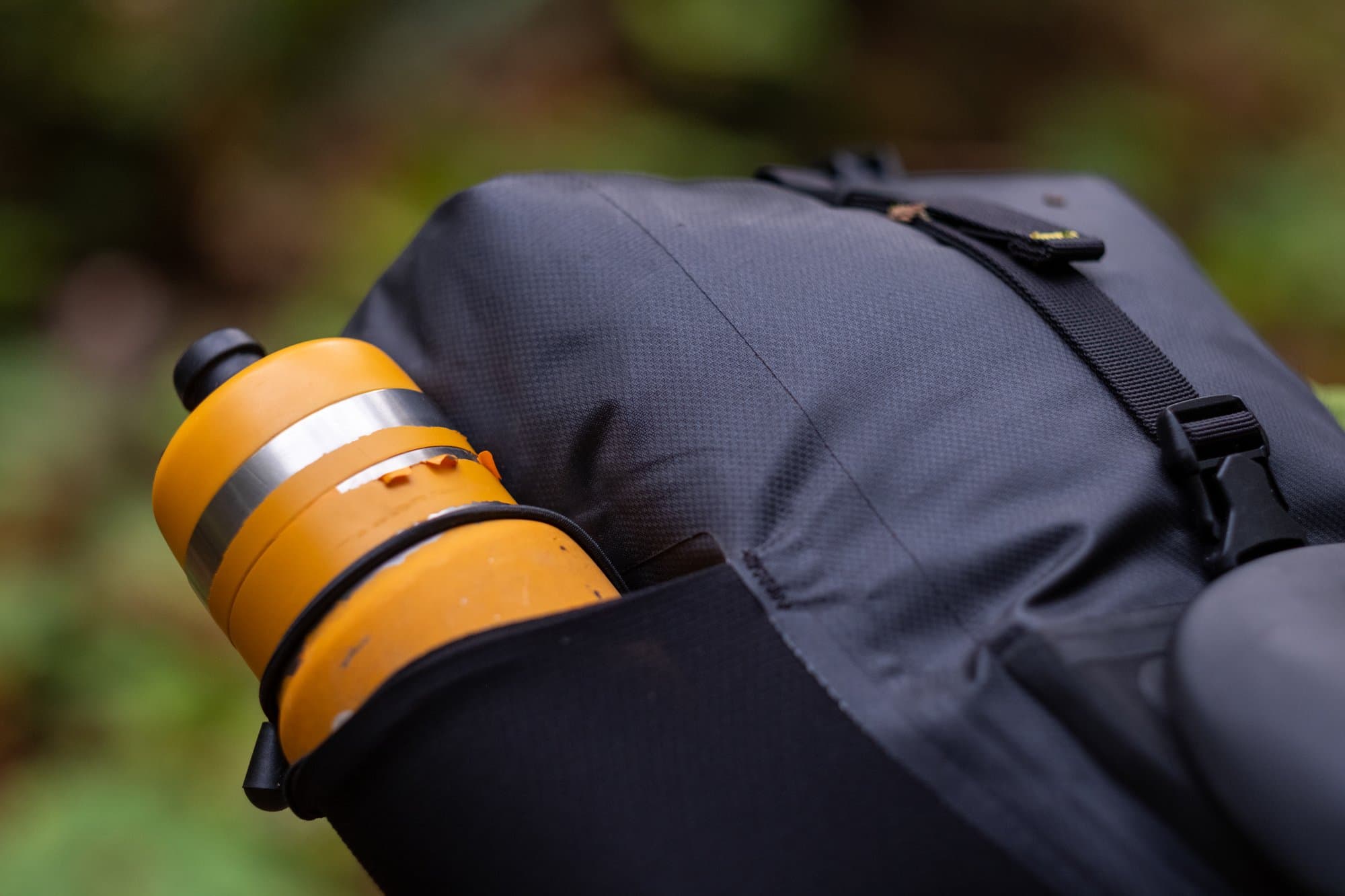 A bottle stashed in the Saddle Pack's mesh side pocket.