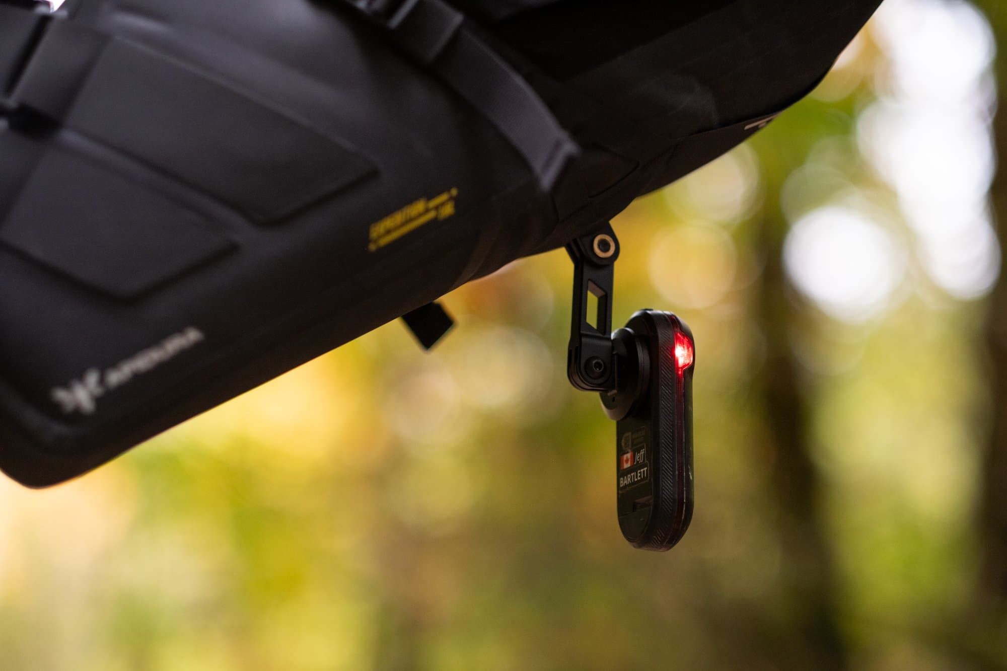 A Garmin Varia hanging from the Saddle Pack's optional GPS mount.