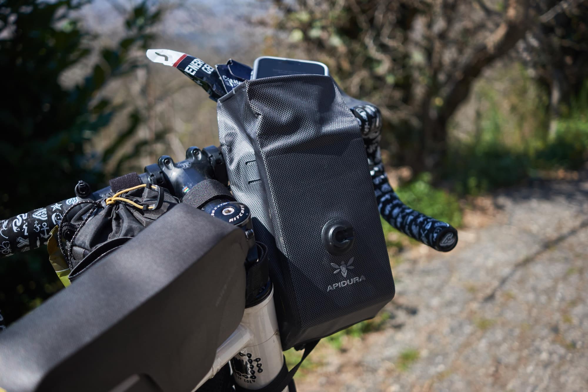 A phone in a Apidura Expedition Stem Pack.