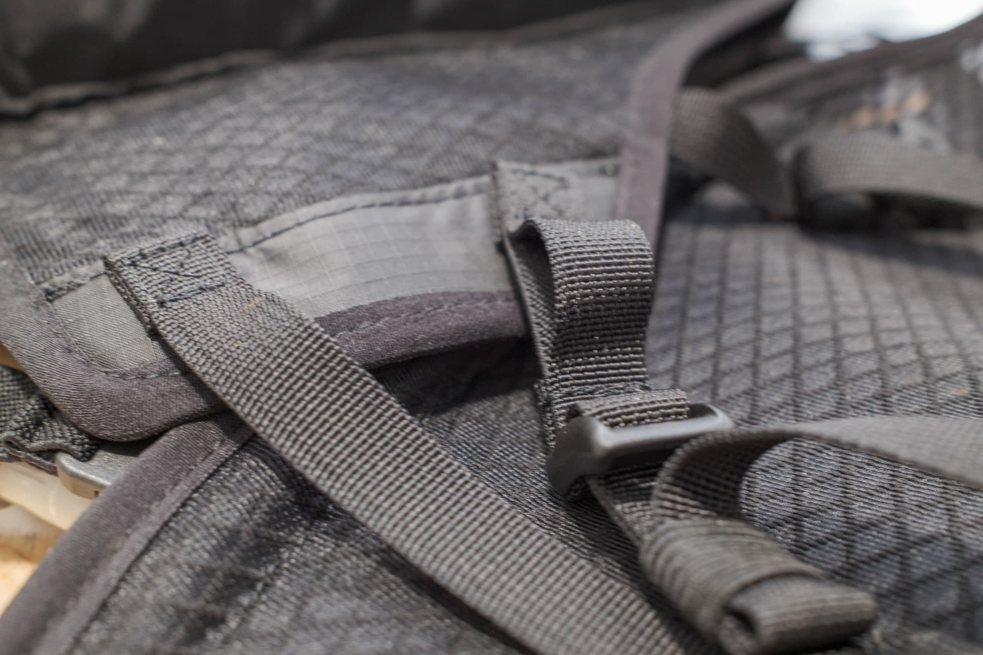 Apidura Racing Hydration Vest buckle detail.