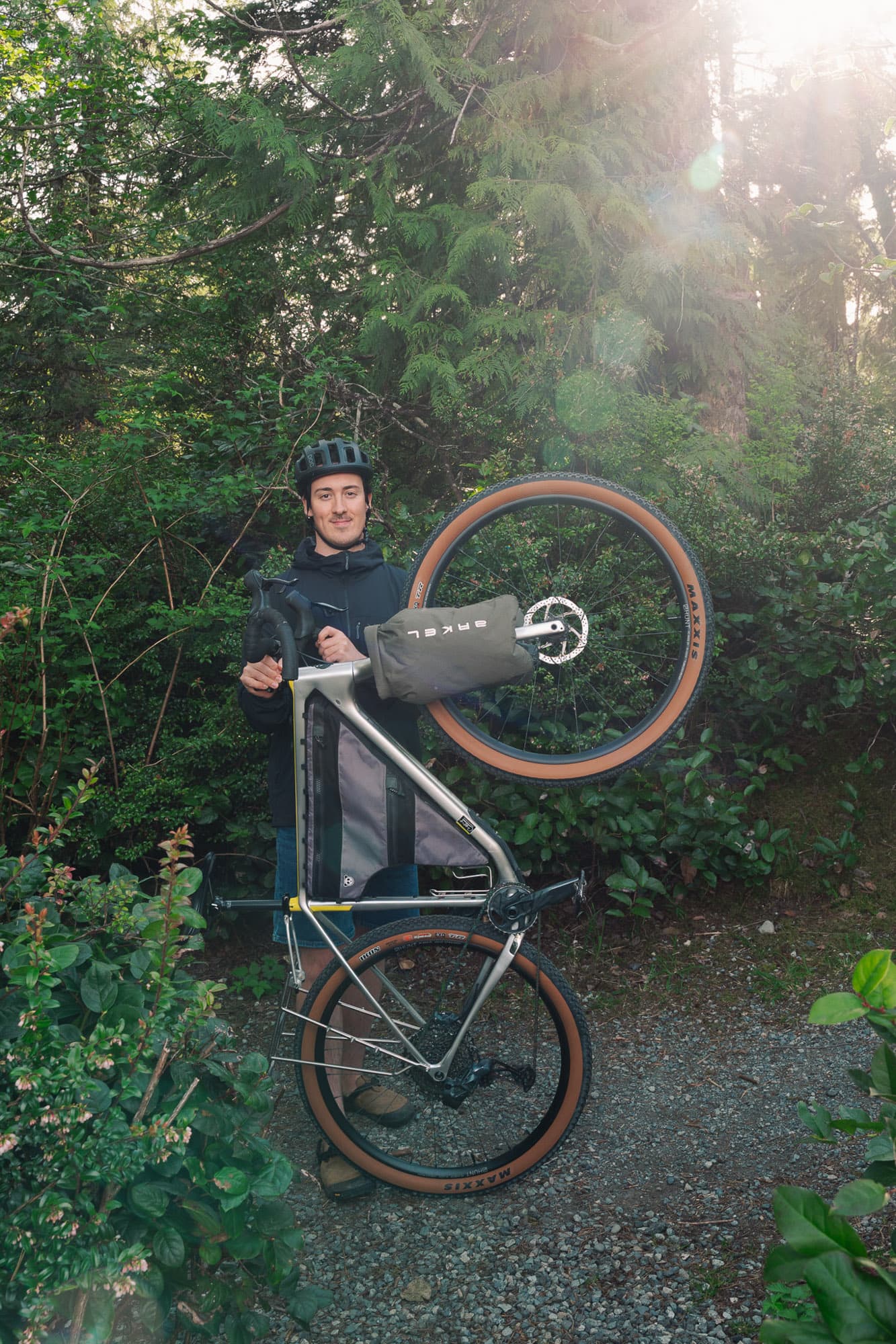Loaded bike standing in a misty coastal forest.