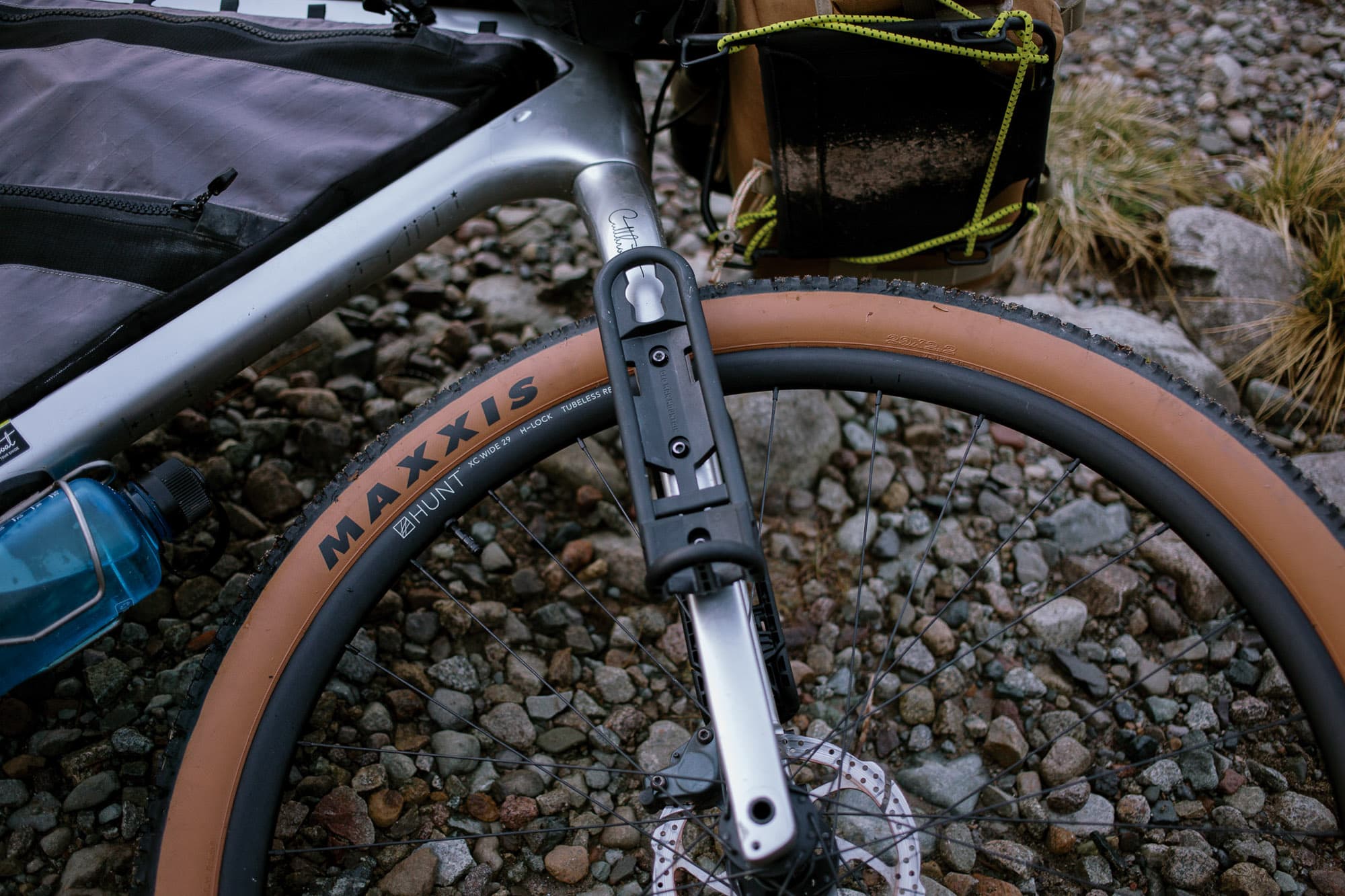 Close-up of the FLiP cage hardware bolted to the fork.